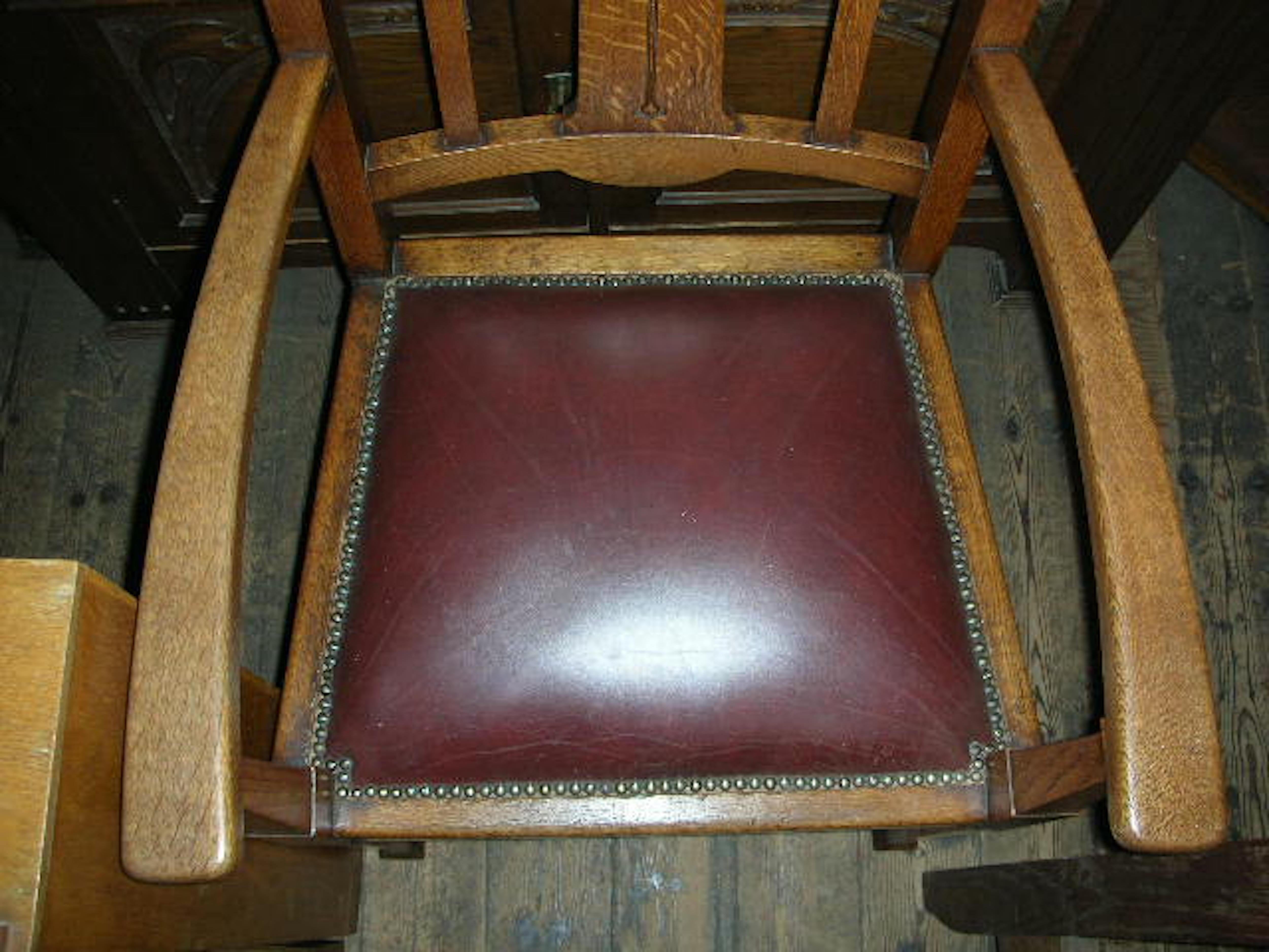 Early 20th Century Shapland & Petter, a Set of Six Arts & Crafts Oak Dining Chairs with Two Carvers