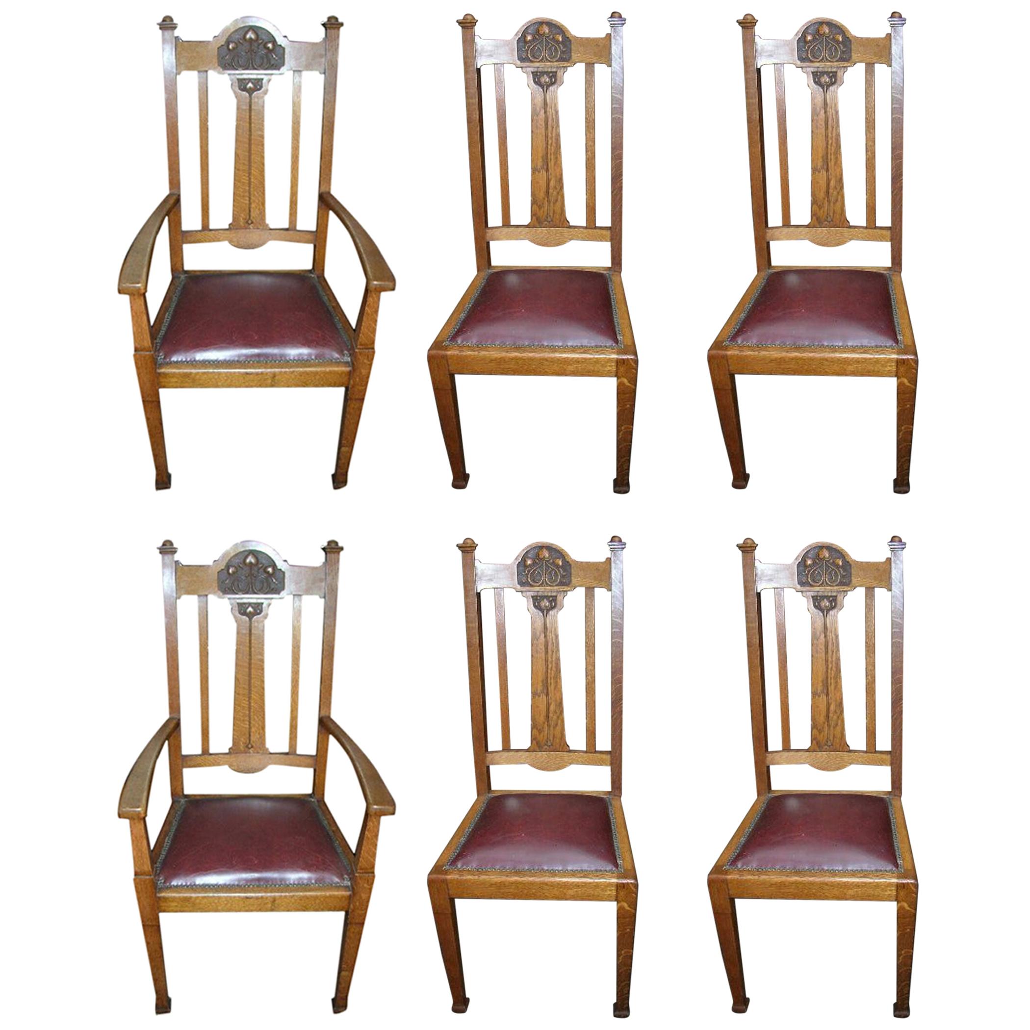 Shapland & Petter, a Set of Six Arts & Crafts Oak Dining Chairs with Two Carvers