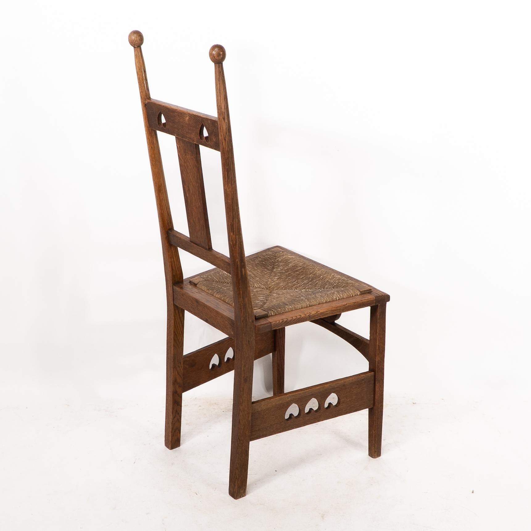 Shapland & Petter. An Arts & Crafts oak desk or side chair with pierced hearts For Sale 7