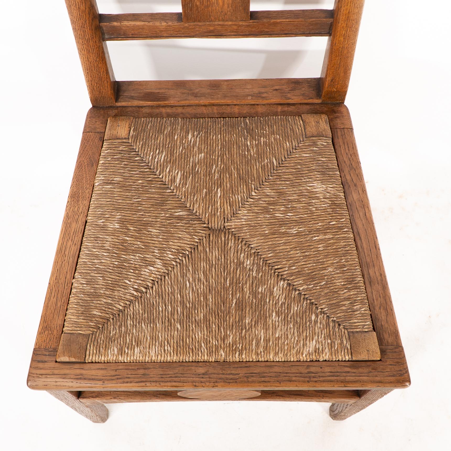Shapland & Petter. An Arts & Crafts oak desk or side chair with pierced hearts For Sale 2