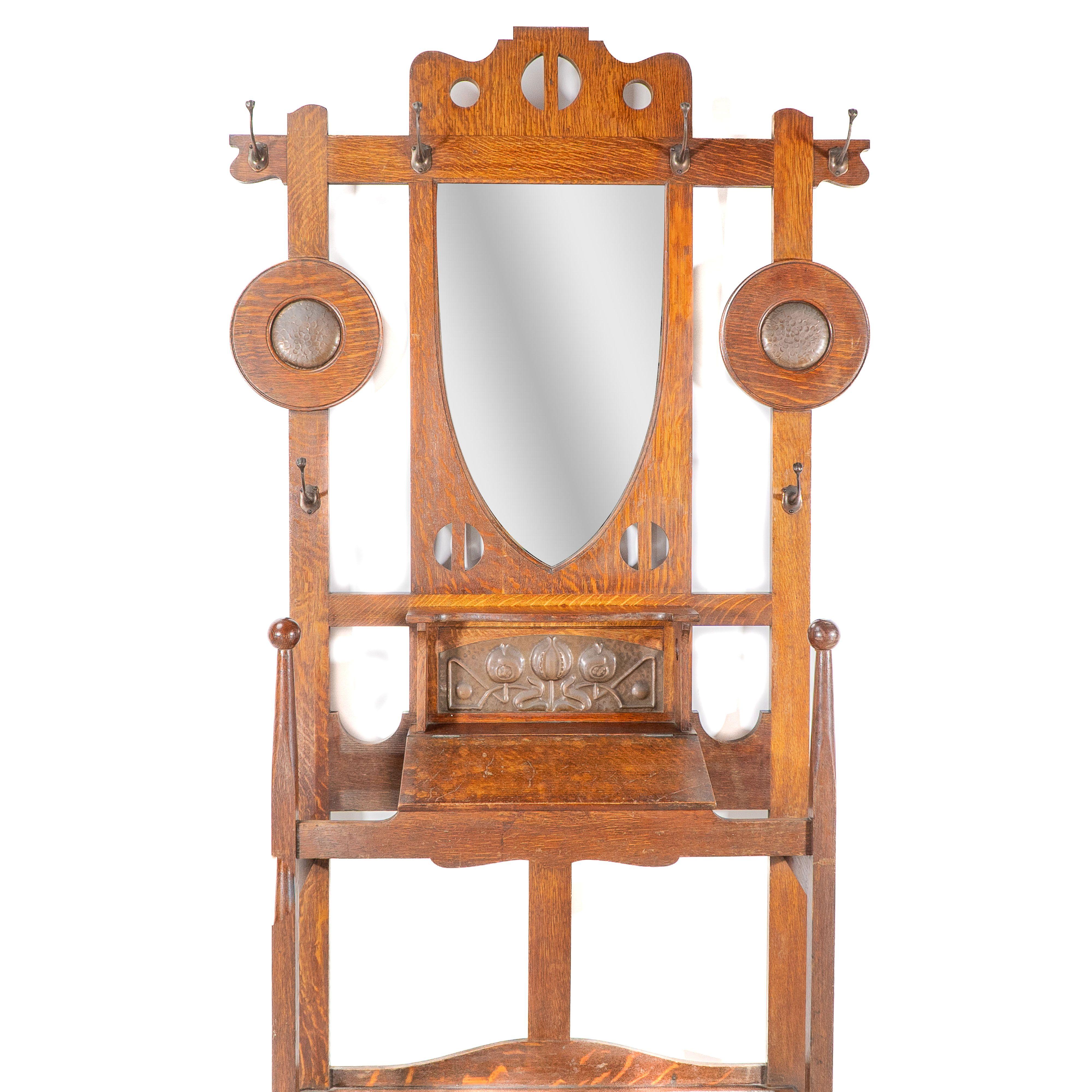 Early 20th Century Shapland & Petter. An Arts & Crafts oak hallstand with mirror and copper panel For Sale