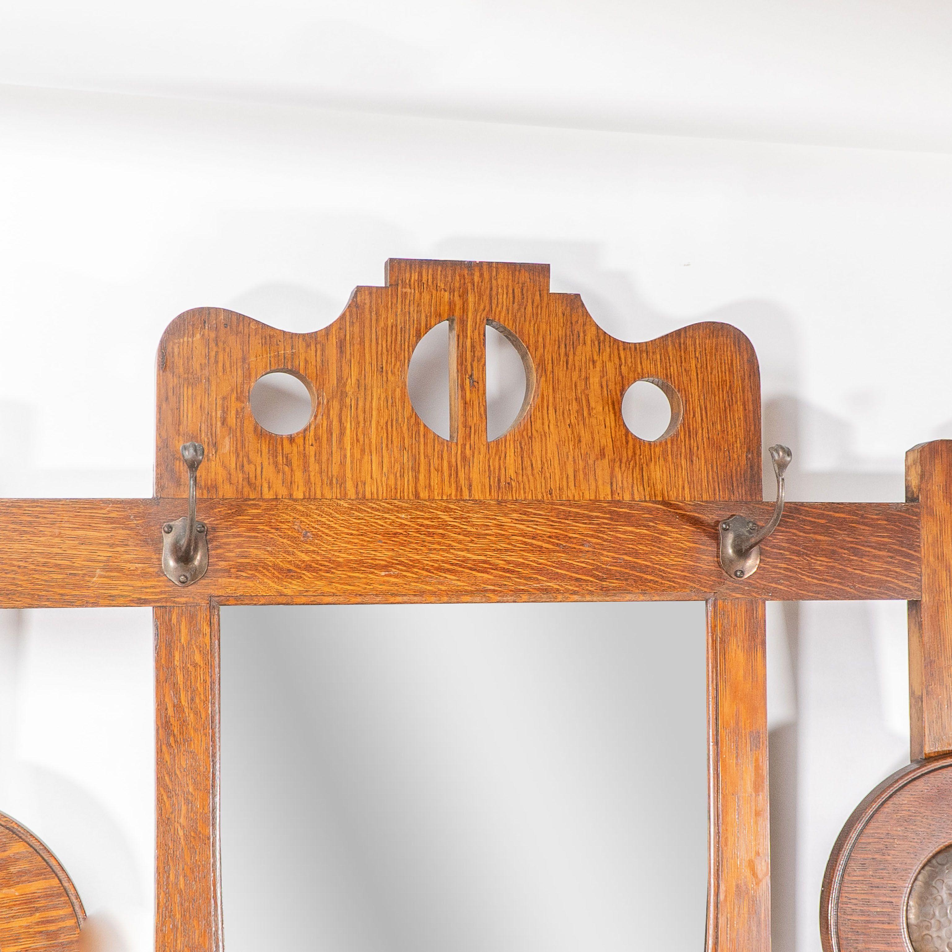 Copper Shapland & Petter. An Arts & Crafts oak hallstand with mirror and copper panel For Sale