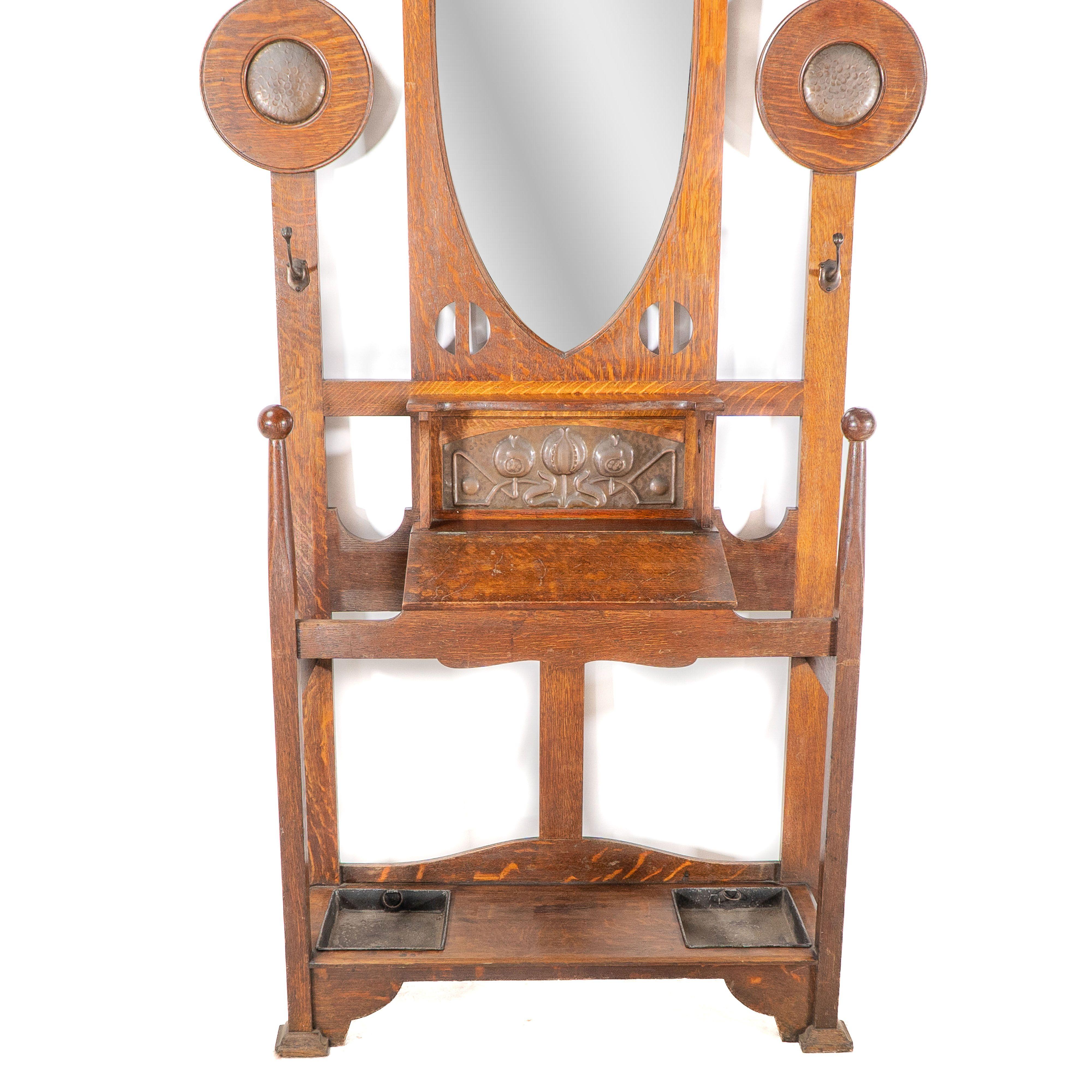 Shapland & Petter. An Arts & Crafts oak hallstand with mirror and copper panel For Sale 1