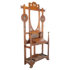 Antique Shapland & Petter. An Arts & Crafts oak hallstand with mirror and copper panel
