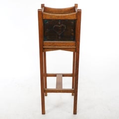 Shapland & Petter. An Arts & Crafts oak planter with copper heart shaped panels