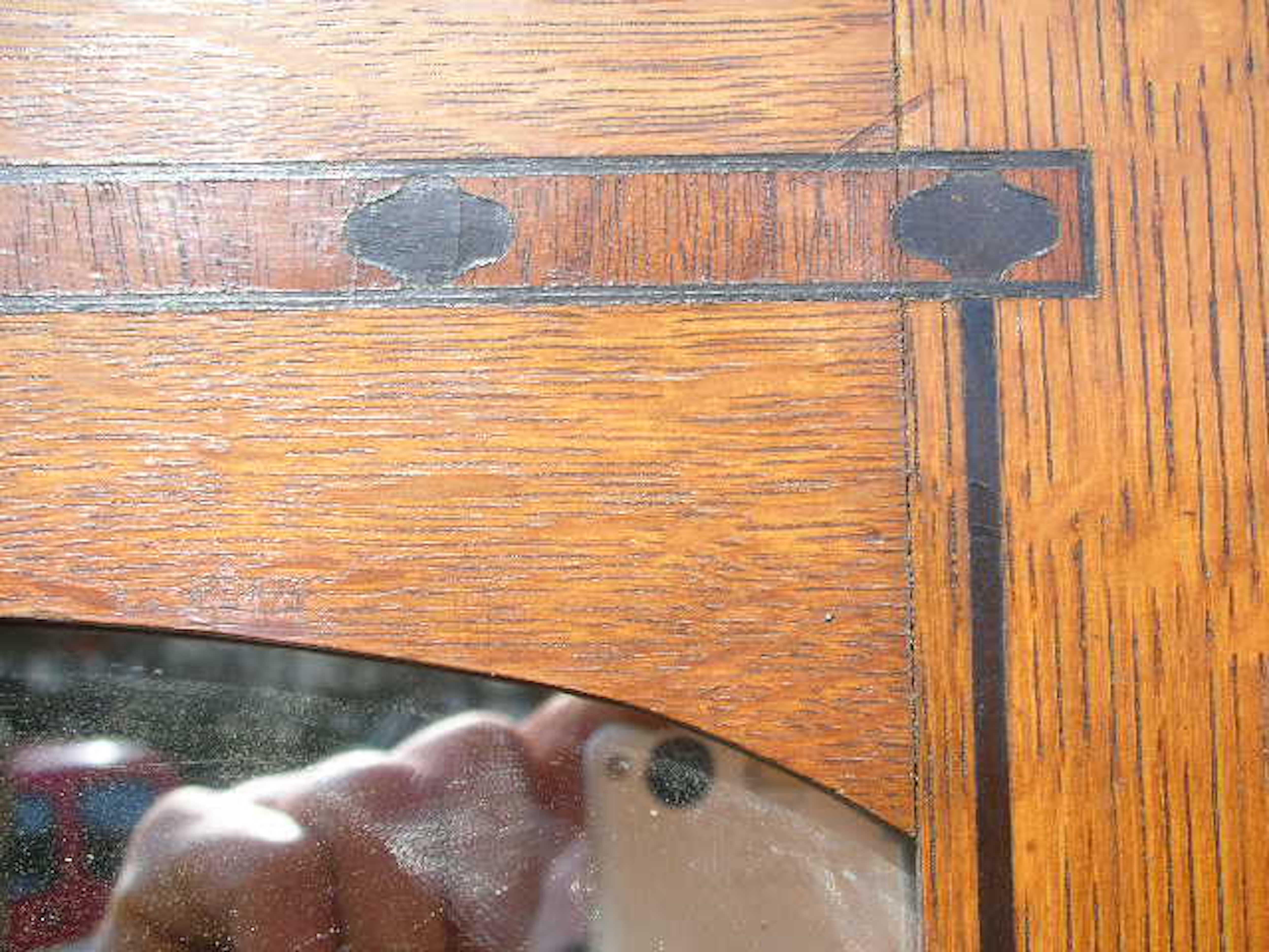 Arts and Crafts Gillows. An Arts & Crafts Oak Treble Wardrobe with Ebony Floral Inlays For Sale