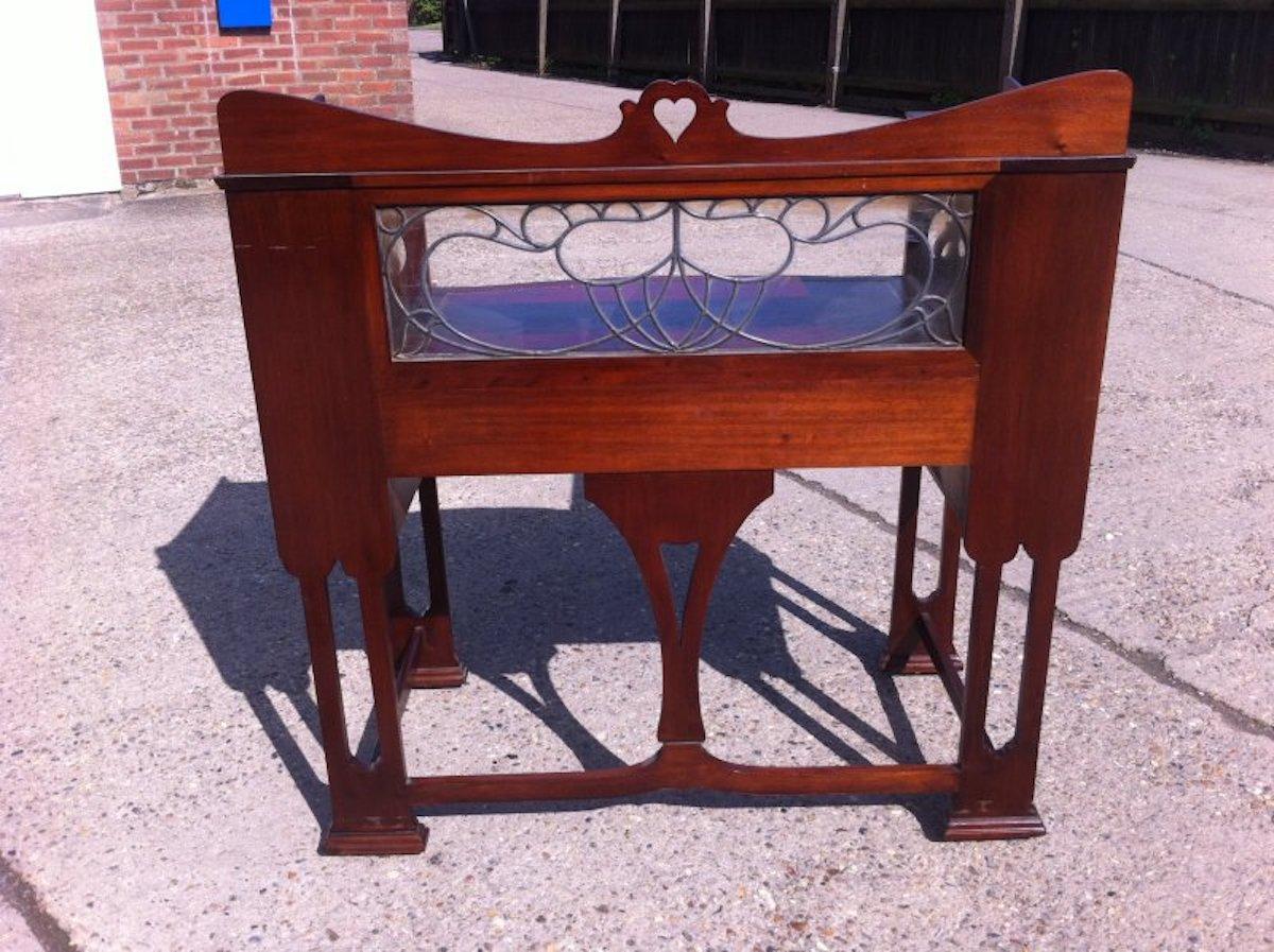 Arts and Crafts Shapland & Petter, Arts & Crafts Mahogany Desk with a Pierced Heart to the Top For Sale