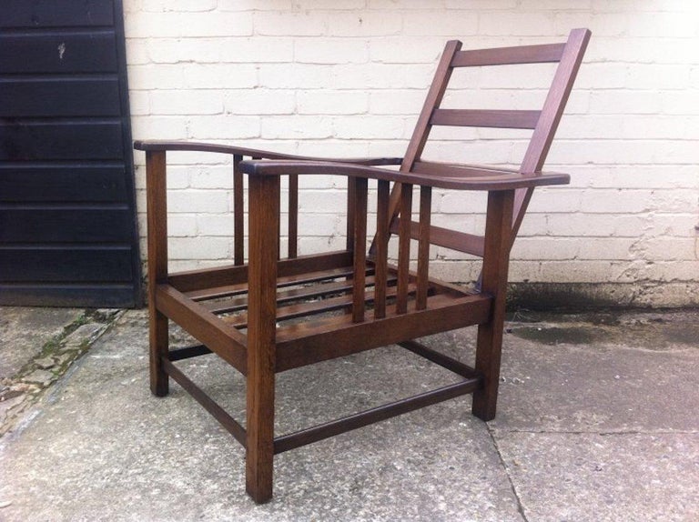 English Shapland & Petter Arts & Crafts Oak Reclining Armchair with Shaped Extended Arms For Sale