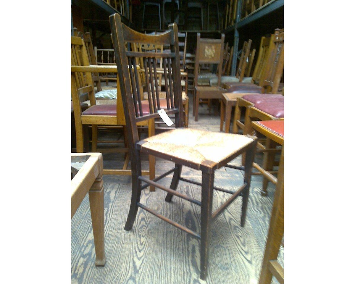 Arts and Crafts Shapland & Petter Attr, a Set of Four Simple Arts & Crafts Rush Seated Chairs For Sale