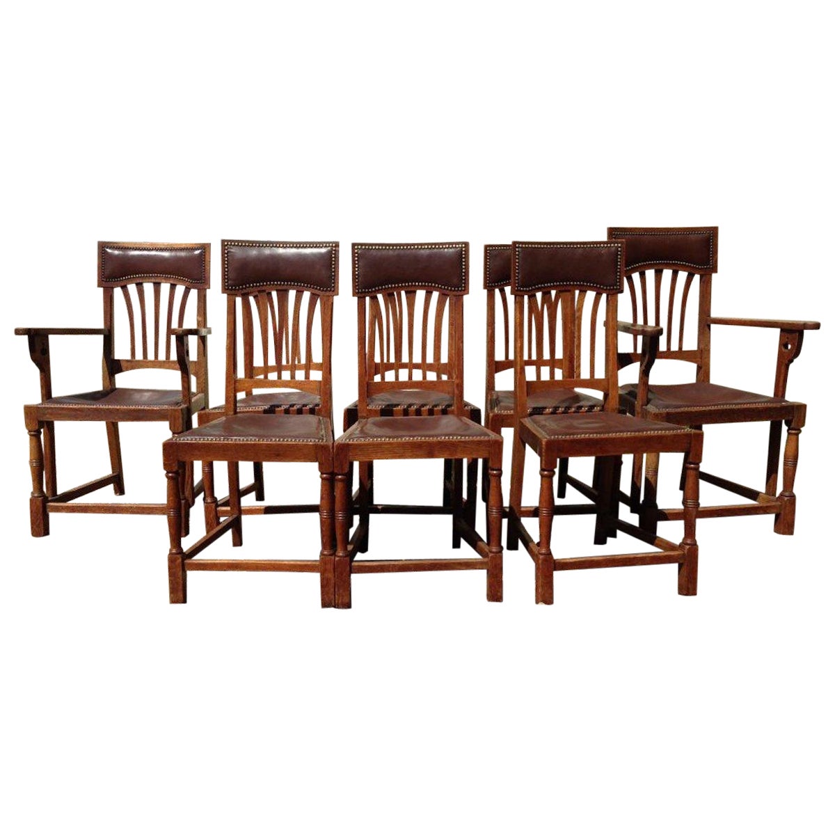 Shapland & Petter Attri: un set di otto sedie da pranzo inglesi in legno di Oak, in stile Arts & Crafts