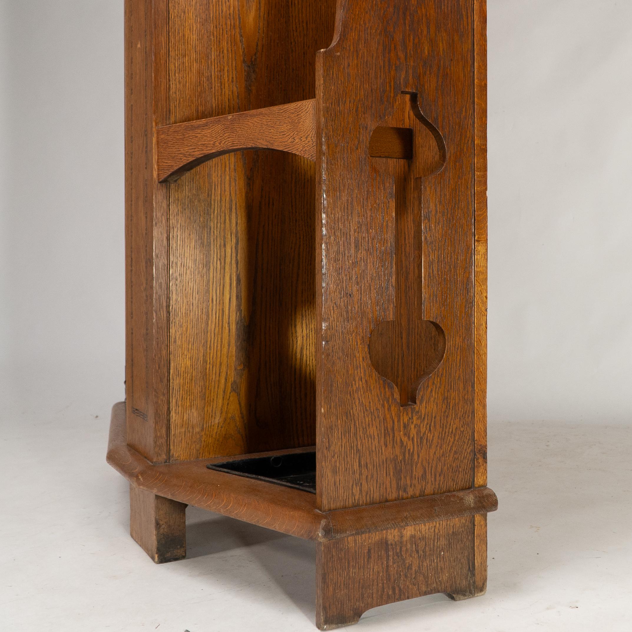 Shapland & Petter attri. An Arts & Crafts oak hall cupboard with flaring cornice For Sale 8