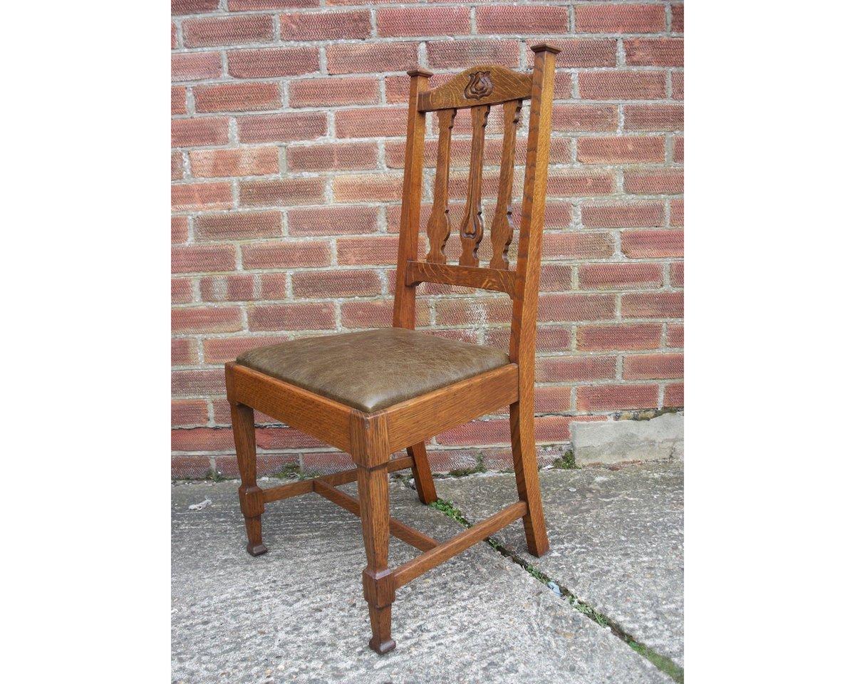 Shapland and Petter.
A set of four Arts & Crafts dining chairs with stylised floral carved head rail and back splats, the front legs with gentle 'in and out' curving to all four facets. These have all been totally restored, all gently knocked