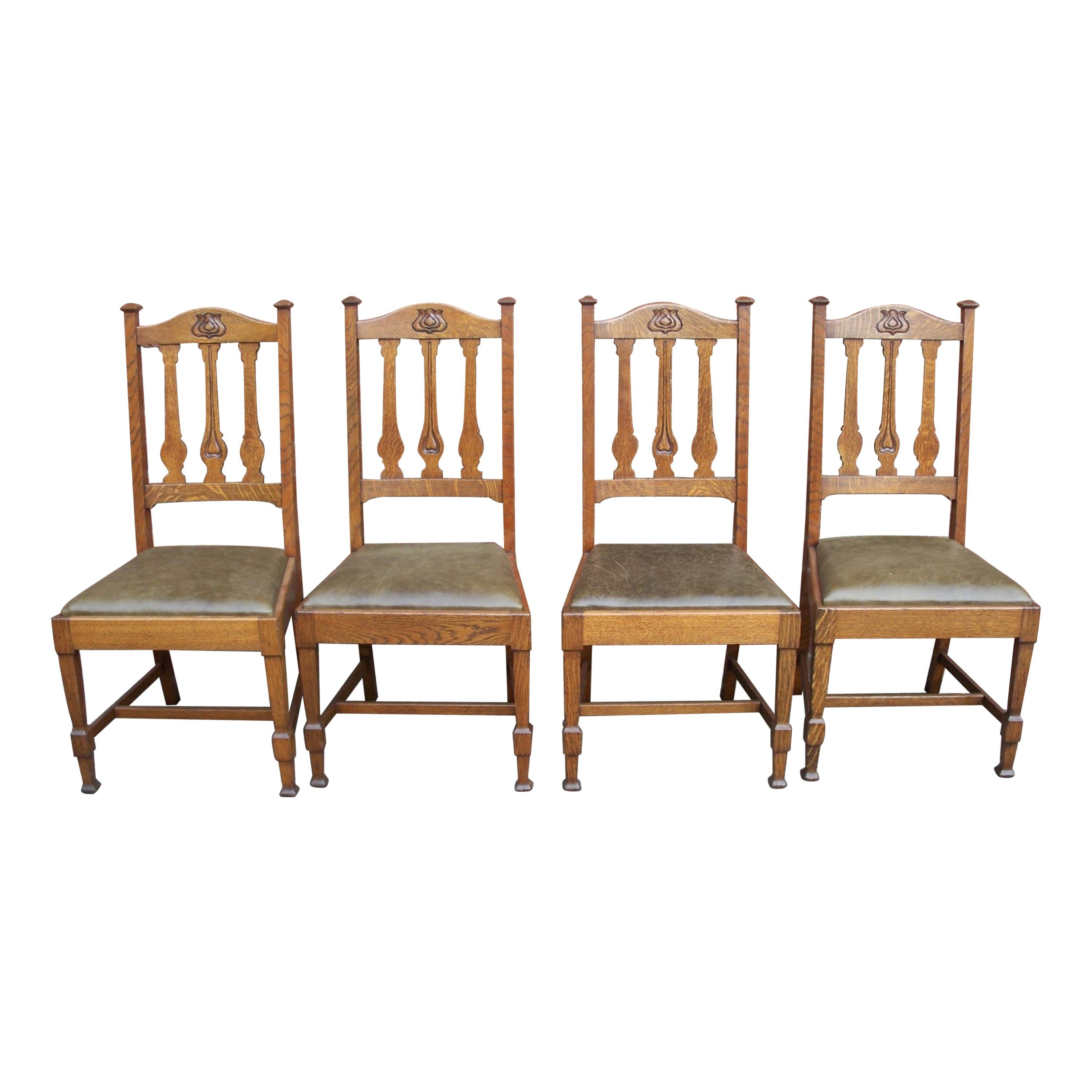 Shapland & Petter, Four Arts & Crafts Oak Dining Chairs with Floral Details