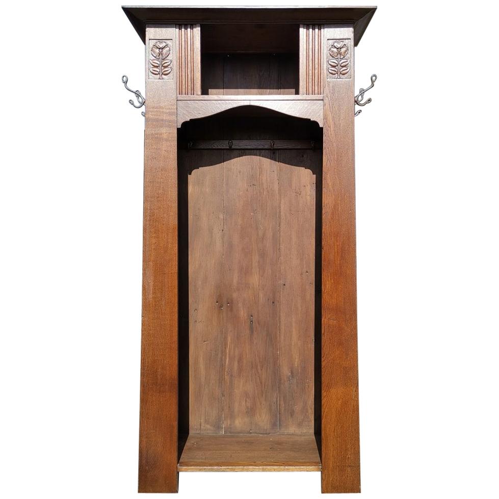 Shapland & Petter, Style of MH Baillie Scott, an Arts & Crafts Oak Hall Cupboard For Sale