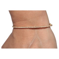 Share Vintage Circa 1990s 14k Gold Natural Diamond Decorated Bangle Bracelet