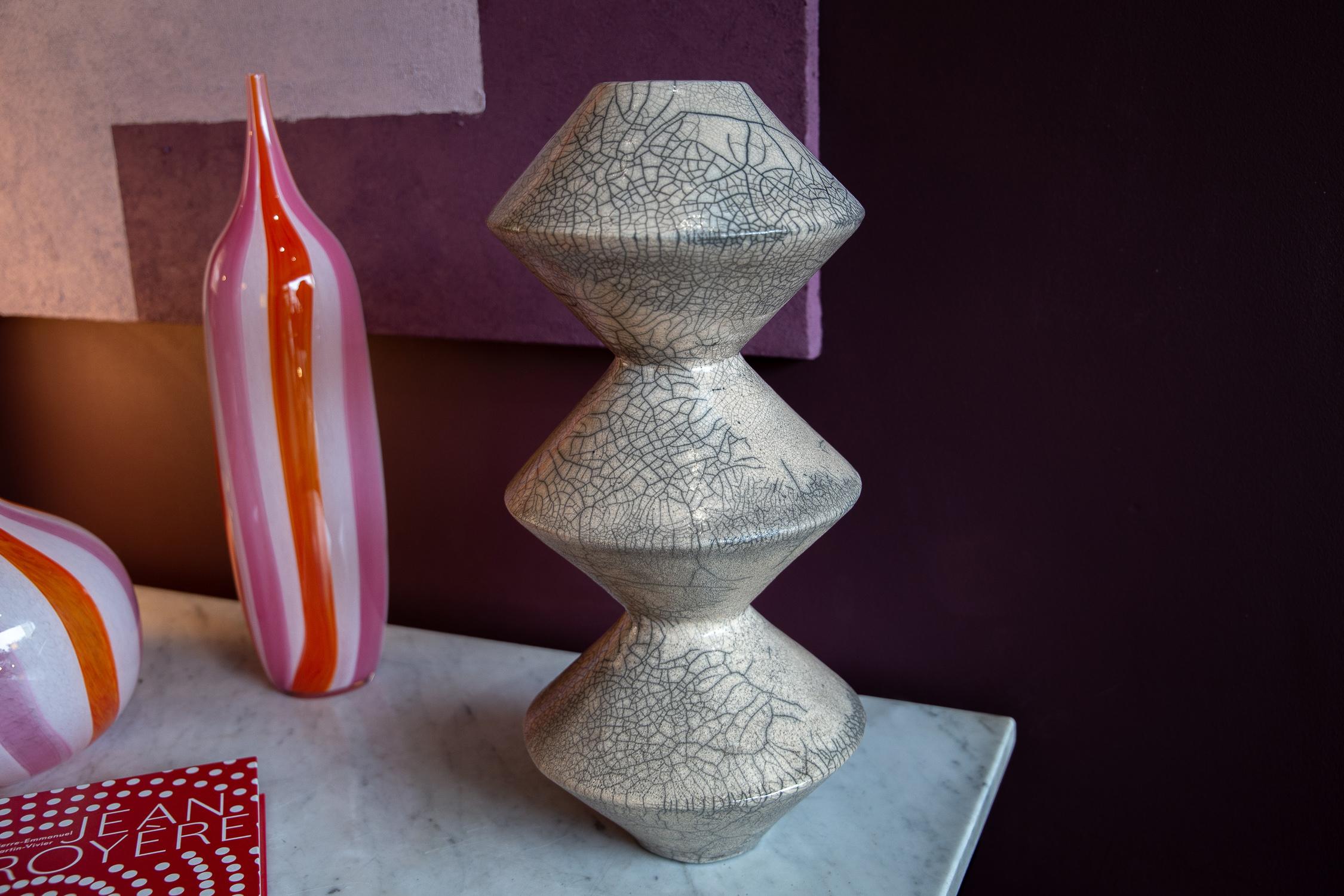 Ceramic casting of a lathe turned form, amalgamating the precision of engineering and the mystery of ceramics; a sculptural object with the appearance of machine like practicality, but with the fragility and tactile energy of natural material.
