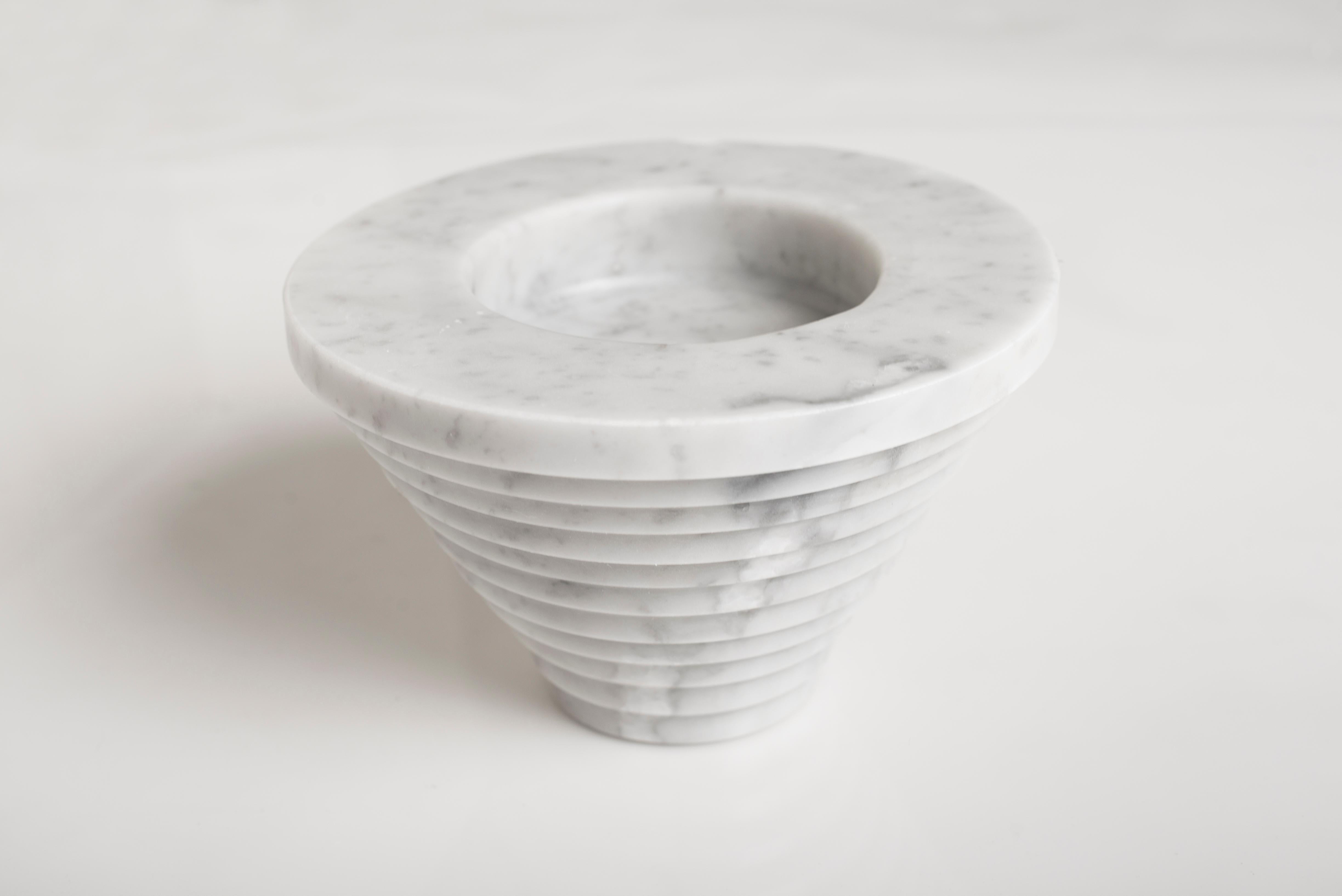 Sharjah sculpture by Carlo Massoud
Handmade 
Dimensions: D 15 x H 13.5 cm 
Materials: Carrara Marble

Carlo Massoud’s work stems from his relentless questioning of social, political, cultural, and environmental norms. He often pushes his