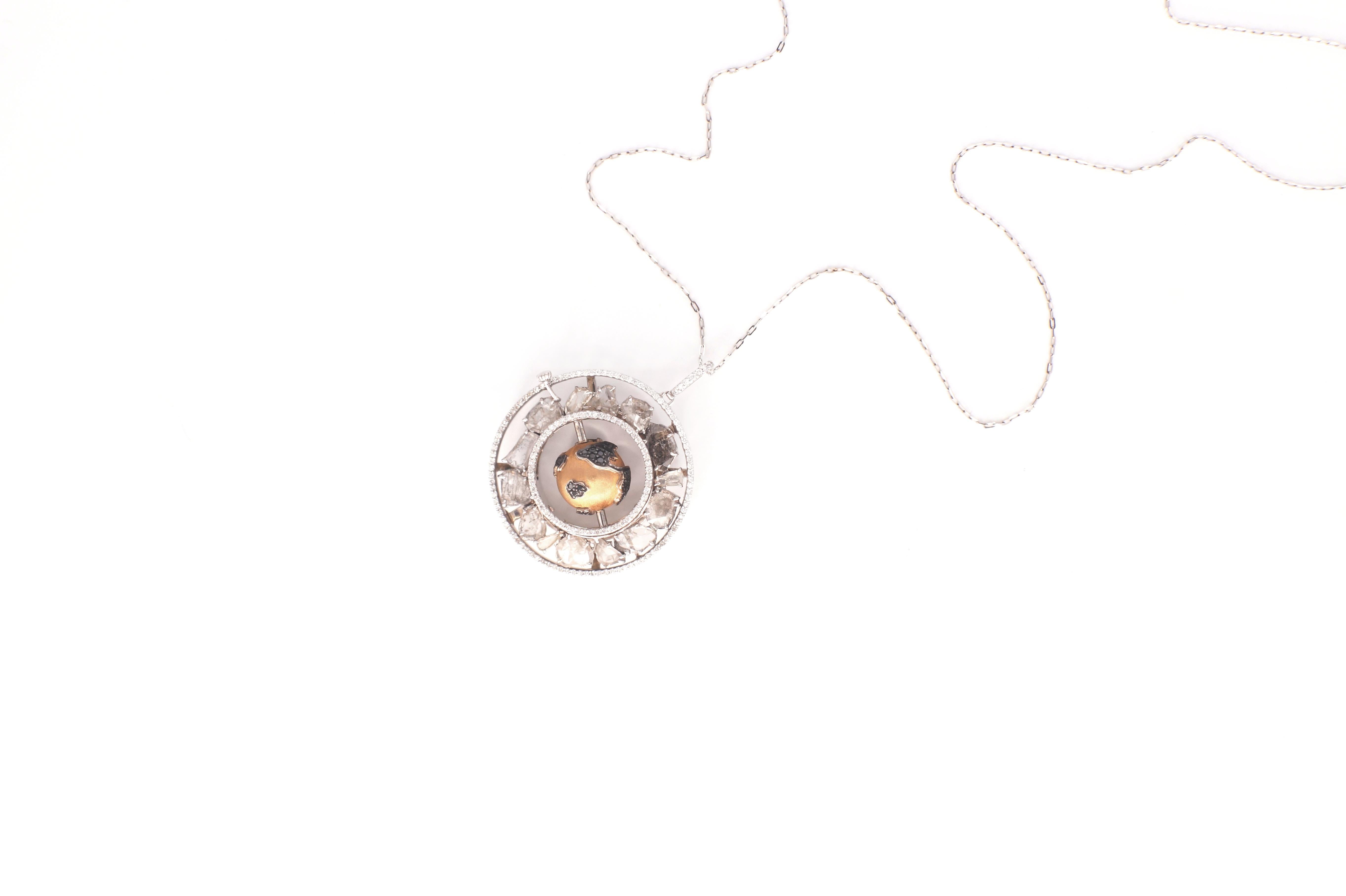 Charley Pendant
A pendant necklace celebrating the world of movement.  The outer frame of this round medallion sports a collection of diamond slices in between two concentric circles of fine white diamonds.  In the middle is an eighteen-karat rose