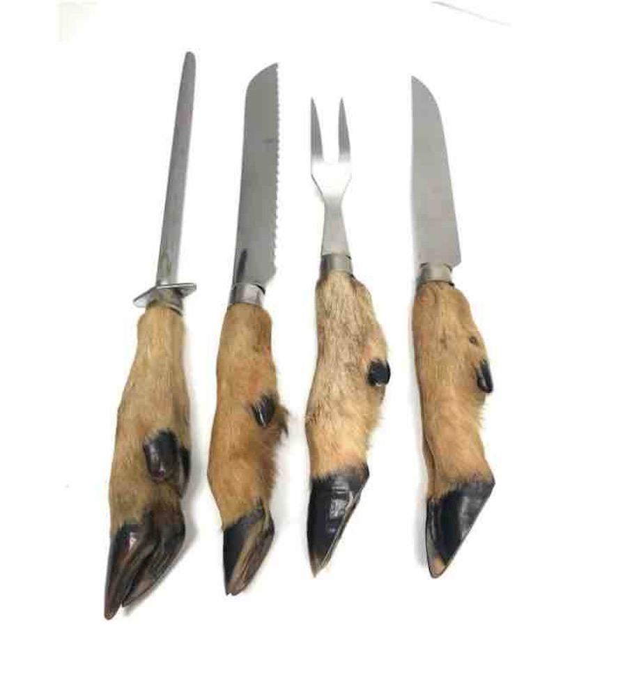 A beautiful vintage carving set. Made of metal and deer feet, it will make a nice addition to any table. Sharpening Steel measures approx. 13 3/4