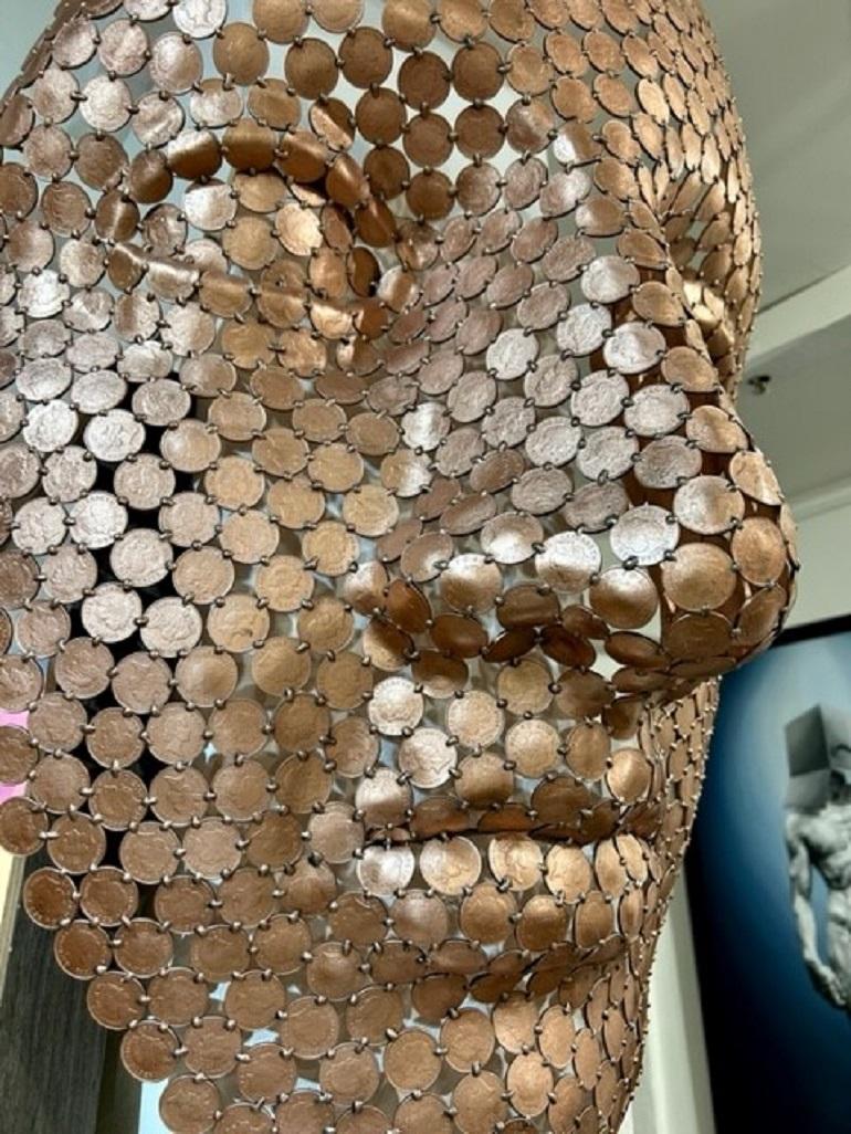Fascinating Wall Sculpture. Each penny intricately welded together to form this perfect face.

Stunning figurative sculpture, The light bounces off each coin, making it really beautiful.

The sculpture is beautifully unique, the perfect addition to