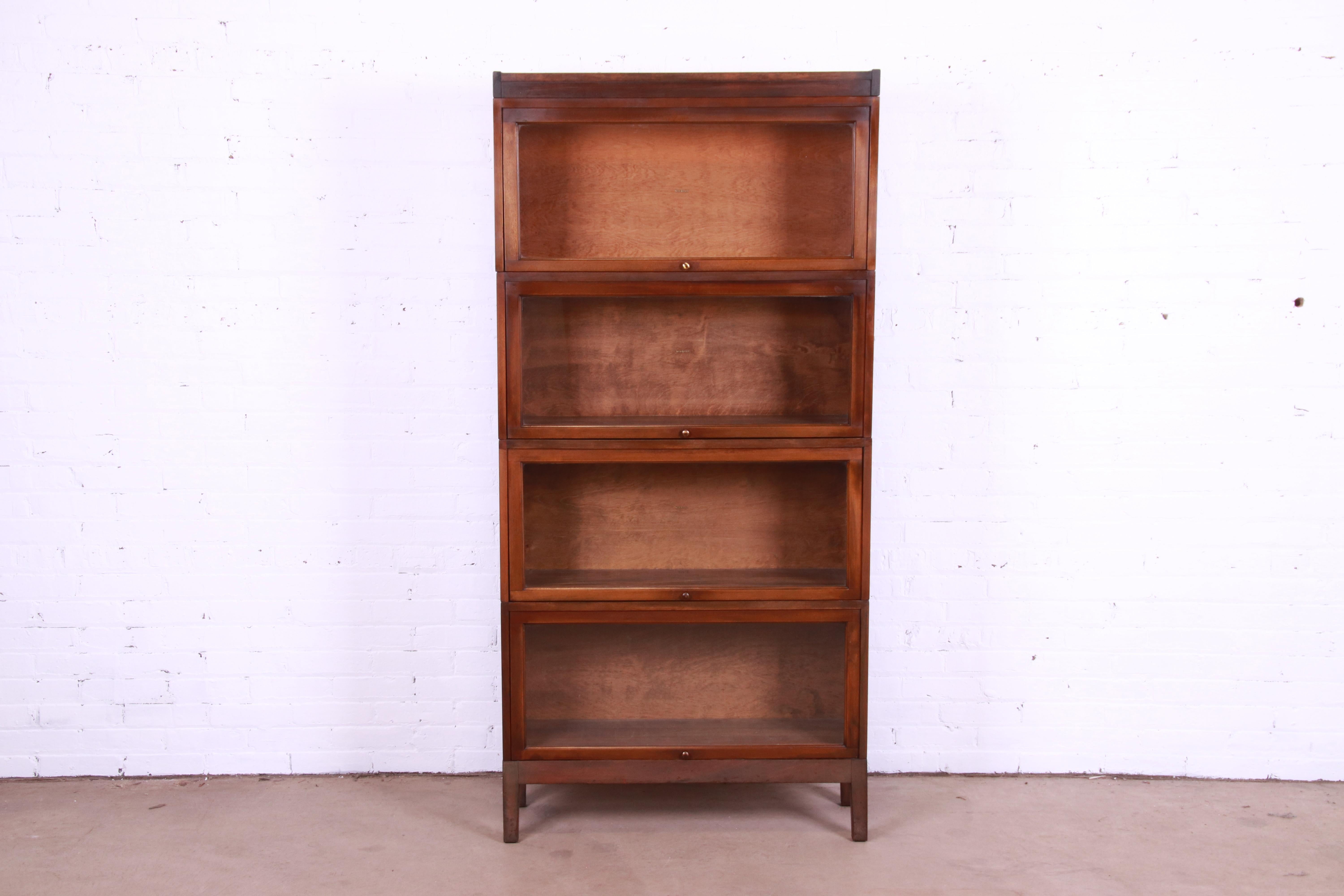 A beautiful antique four-stack barrister bookcase

By Shaw Walker

USA, Circa 1920s

Birch, with glass front doors and brass hardware.

Measures: 34