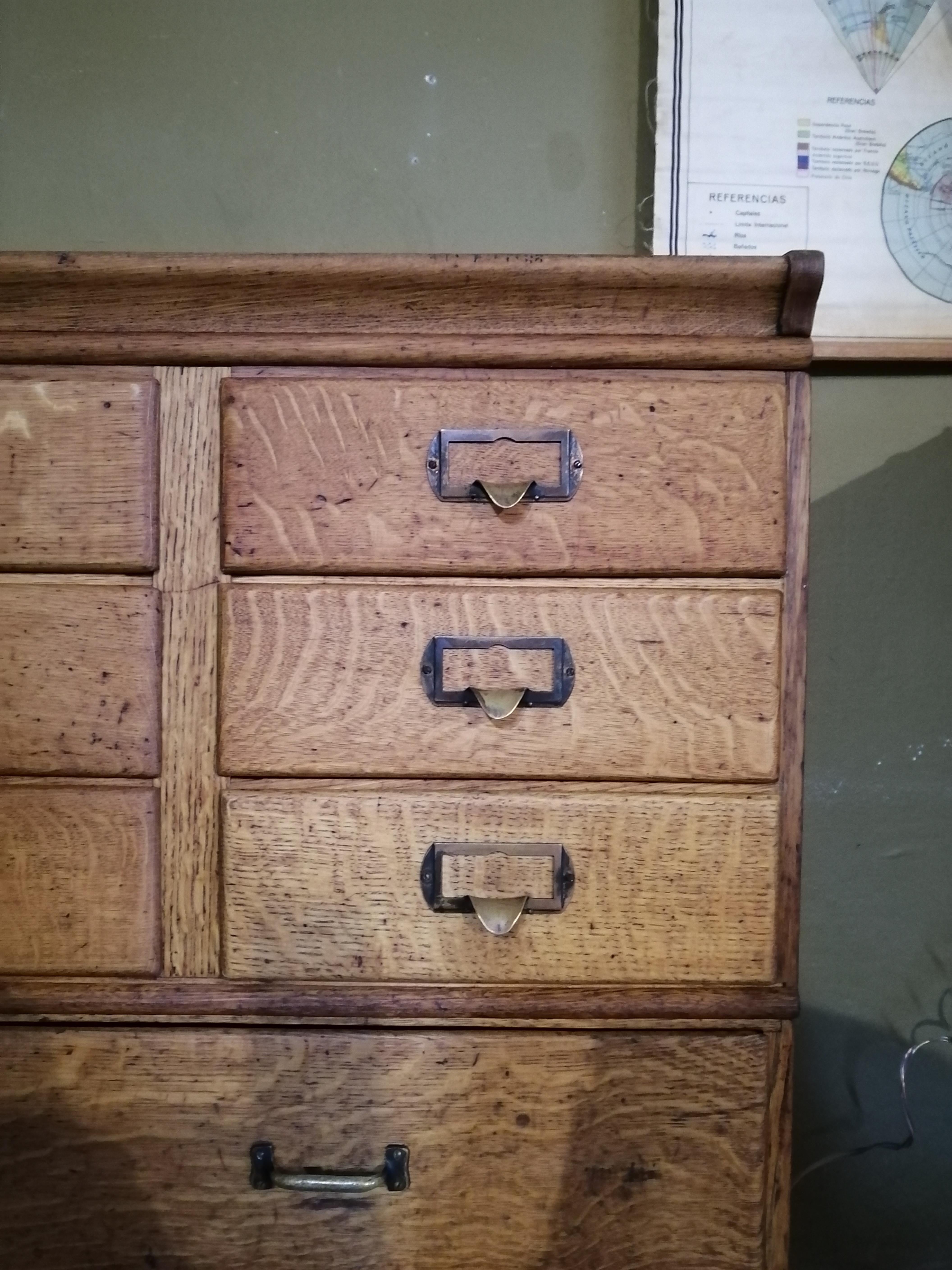 Rare American oak stacking cabinet with drawers by Shaw Walker. The upper body's 9 drawers have brass label handles. The lower body's 4 drawers show regular pulls. It shows the brand sticker on the upper body.