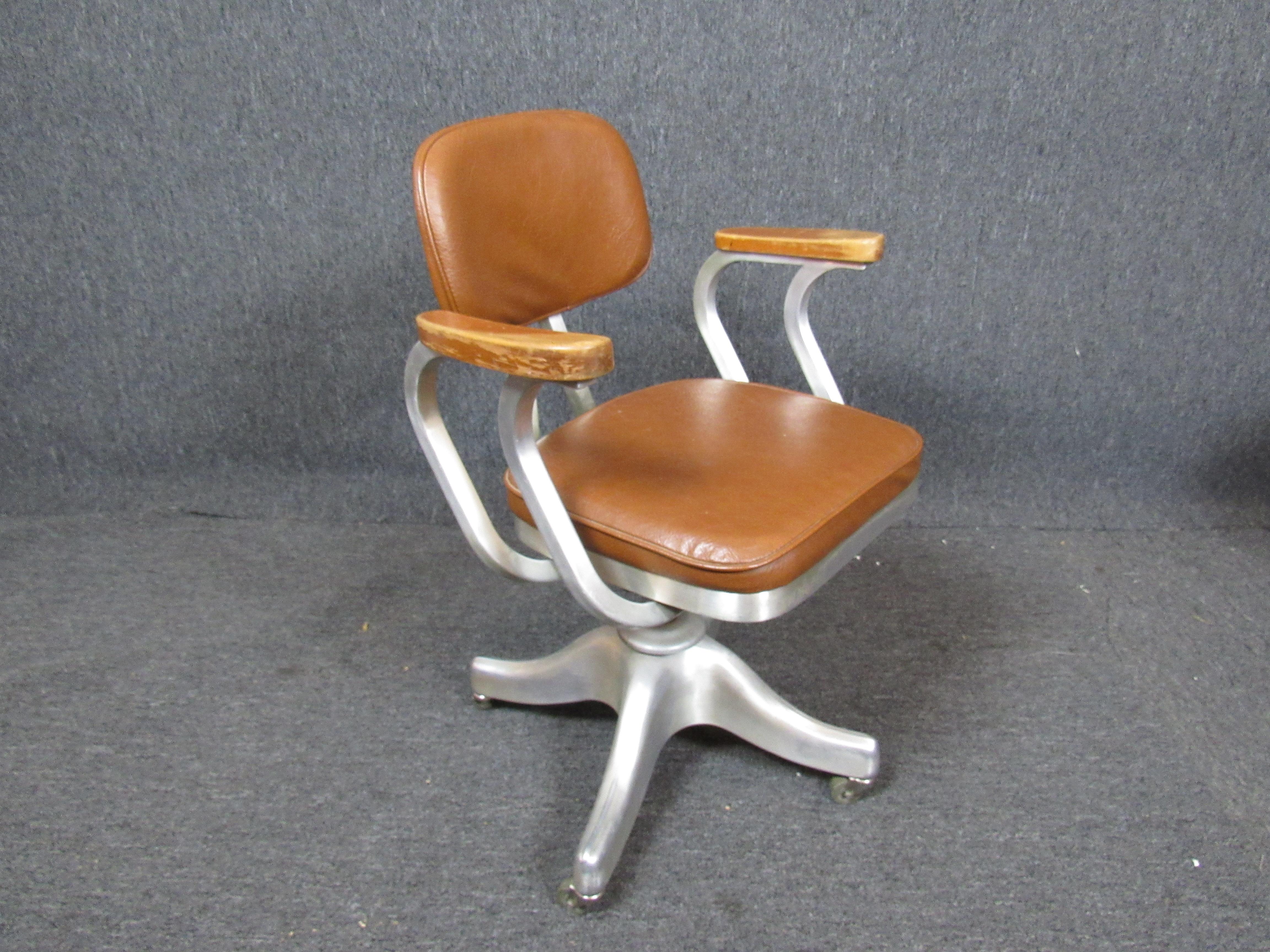 Mid-century modern style office chair by Shaw Walker with aluminum frame and wood arm rests.
Please confirm location NY or NJ.