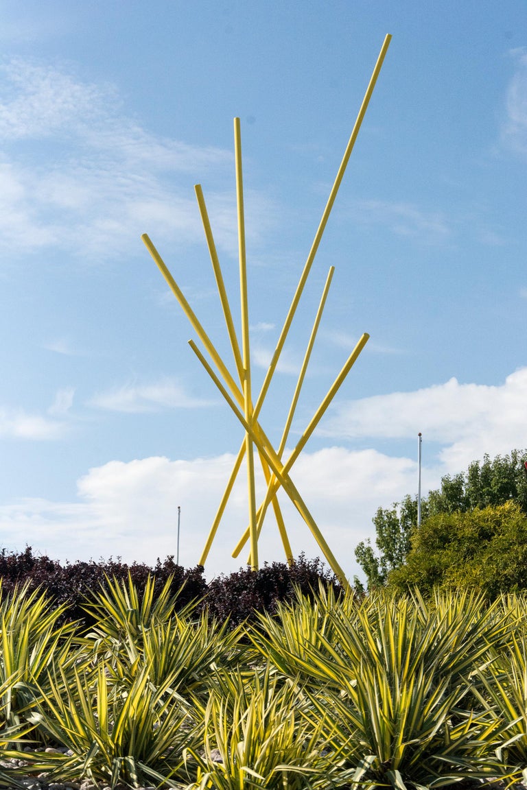Intersecting steel rods are saturated in light Tuscan sun yellow in this dynamic outdoor sculpture by Shayne Dark.

Poised between abstraction and representation, the artworks of Canadian artist Shayne Dark (b. 1952, Moose Jaw, SK) are often coated