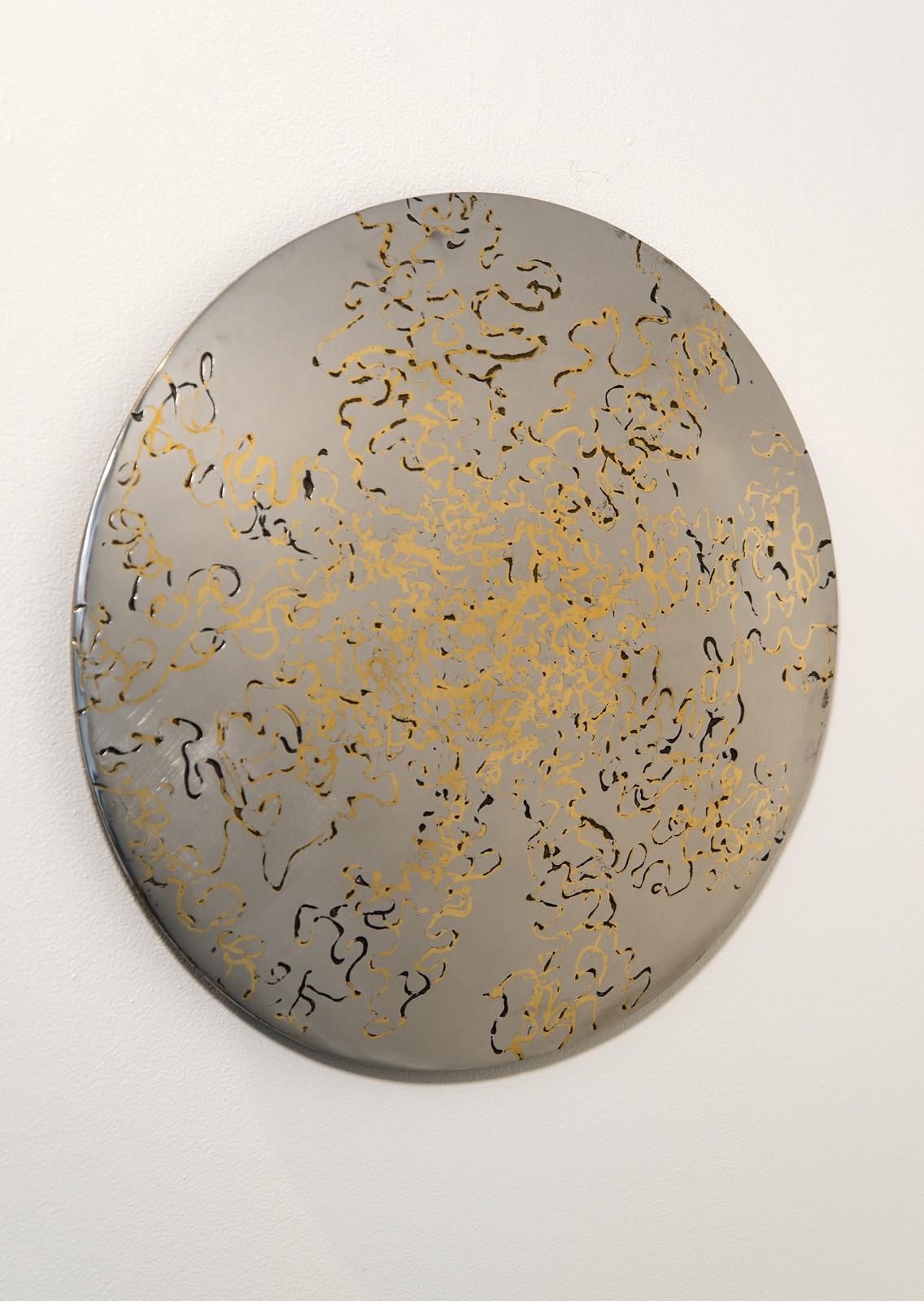 A jewel like surface of polished steel and bronze inlay reflects ambient light in this tondo by Shayne Dark. The pattern cut into the steel surface was sprayed with molten bronze to create the intricate inlay. The artist then buffed the surface back