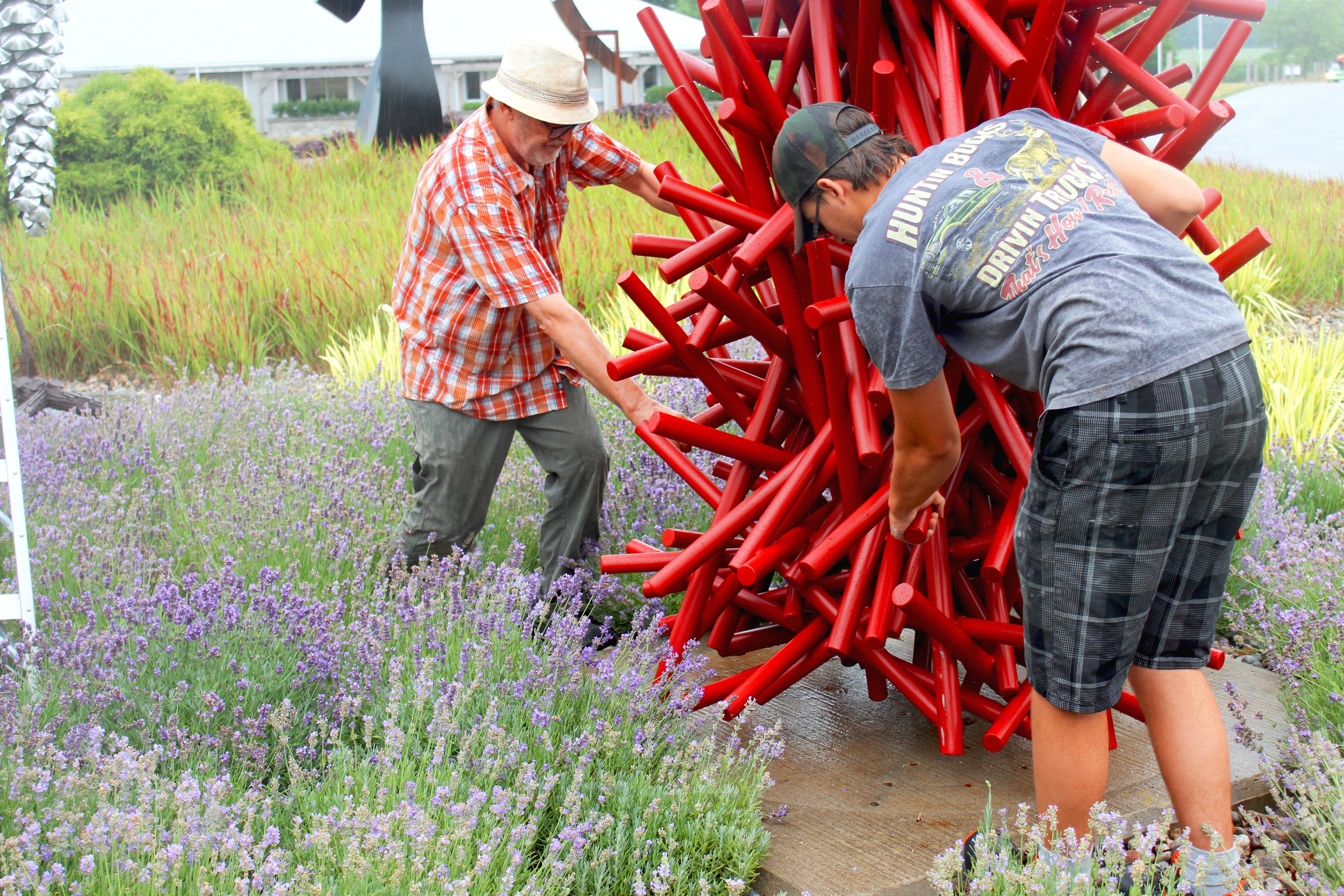 This imposing, rich red metal sculpture by Canadian artist, Shayne Dark is part of the ‘Entangled Series’ he has worked on for years. The contemporary series began in wood, then in small steel works and has evolved into these larger sculptures,