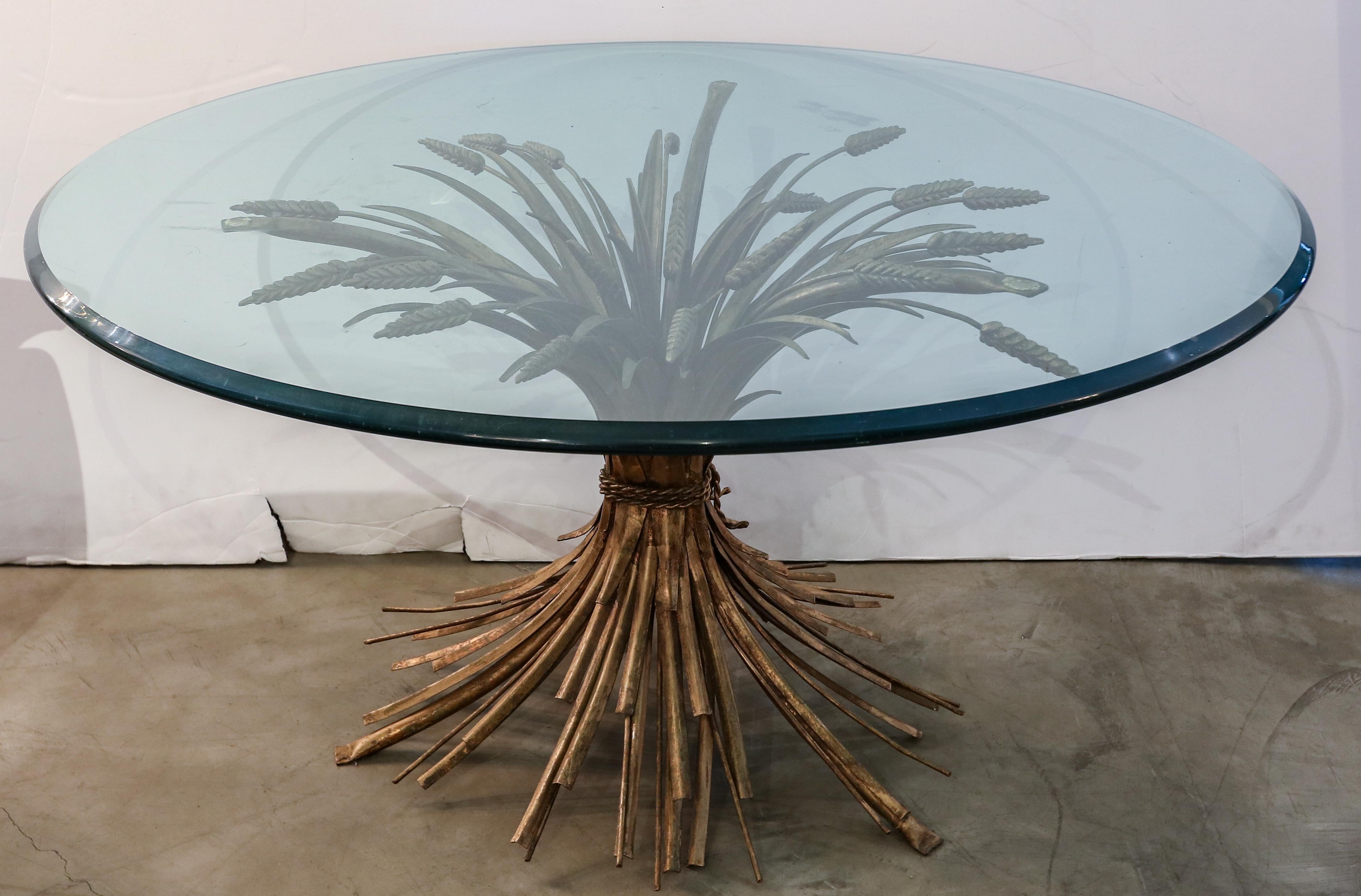 Sheaf of wheat coffee table from 1950s Italy with gilt metal base and round glass top.