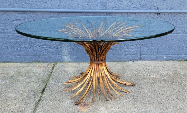 Classic sheaf of wheat coffee or side table with substantial polished edge oval glass top. In the manner of / attributed to Maison Bagues.