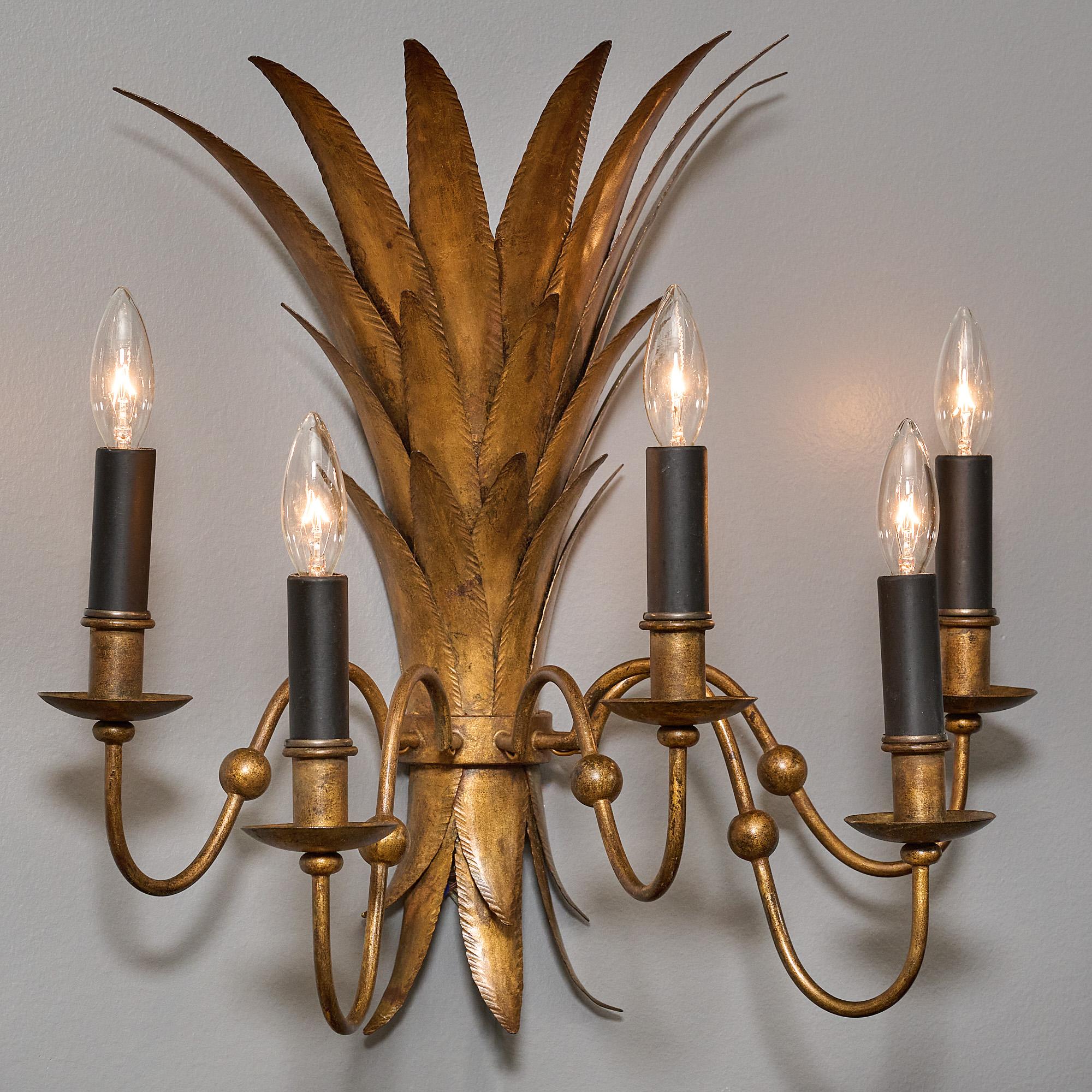 Pair of sconces, French, attributed to Maison Bagues, in the Art deco style, patinated gold leafed finish on “tole” metal, five arms. This piece has been newly rewired to fit US standards.