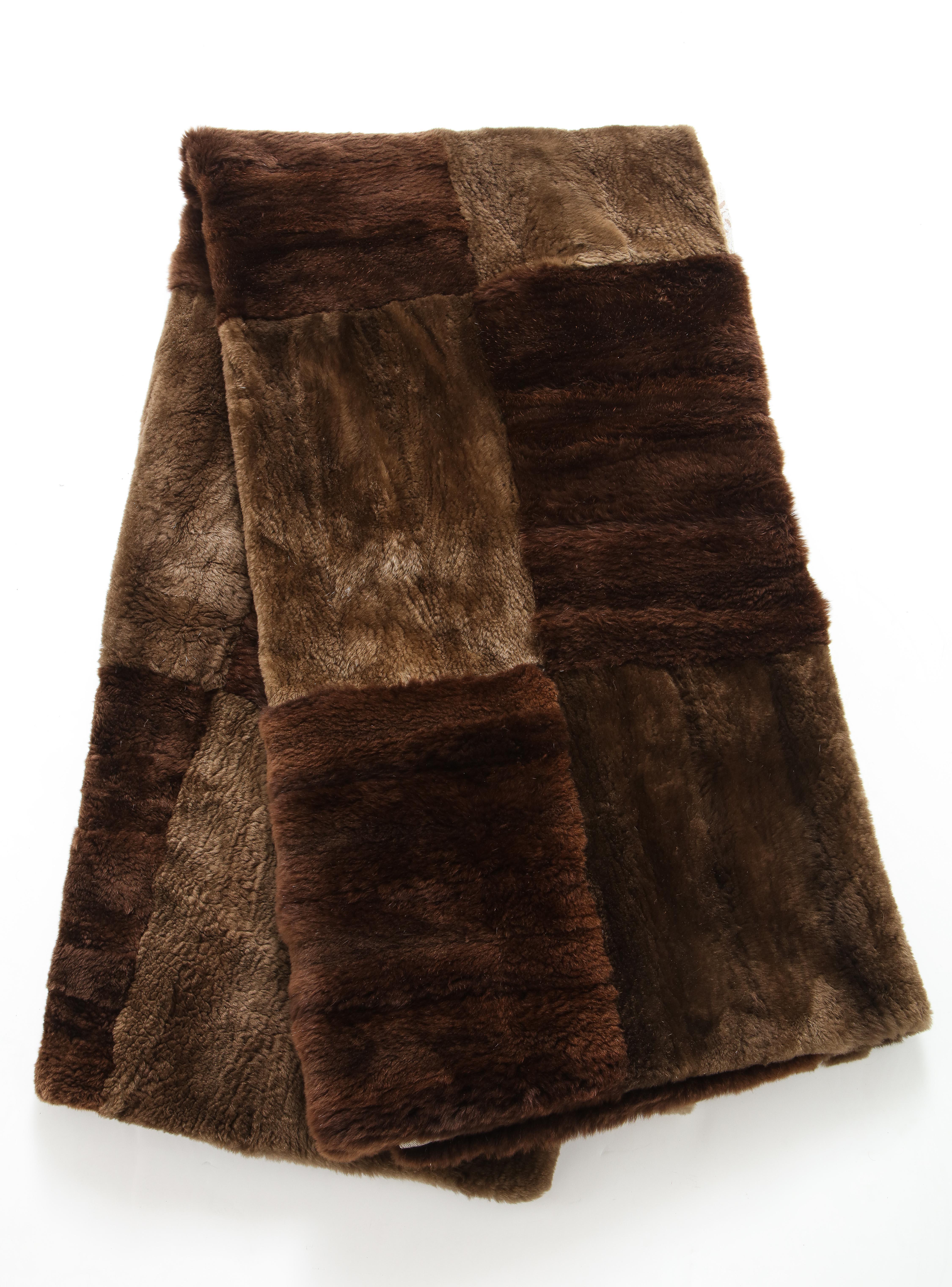 Custom made dark brown sheared beaver throw lined with a beige and bone floral pashmina.
