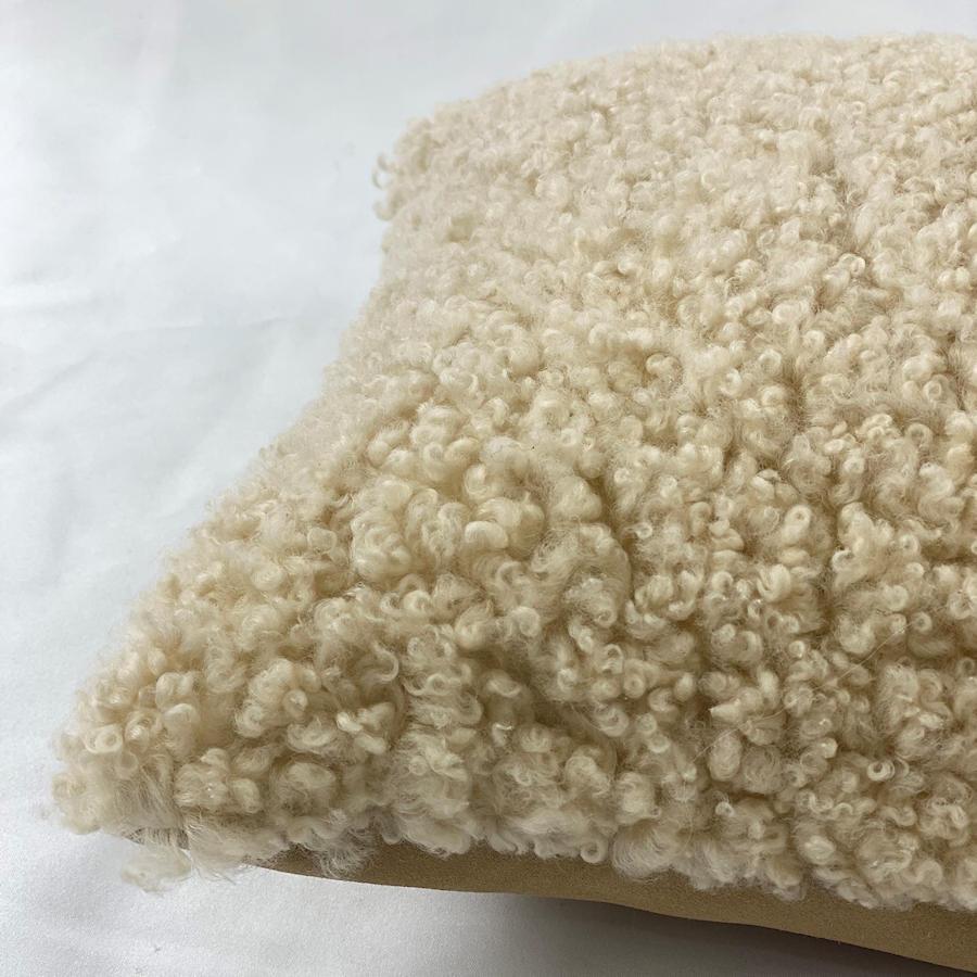 Add charming tactile textures to your interior decor with this large shearling sheepskin pillow. The boucle style wool pile features a short curly wool that will bring sustainable styling to life. Translating contemporary design paralleled with
