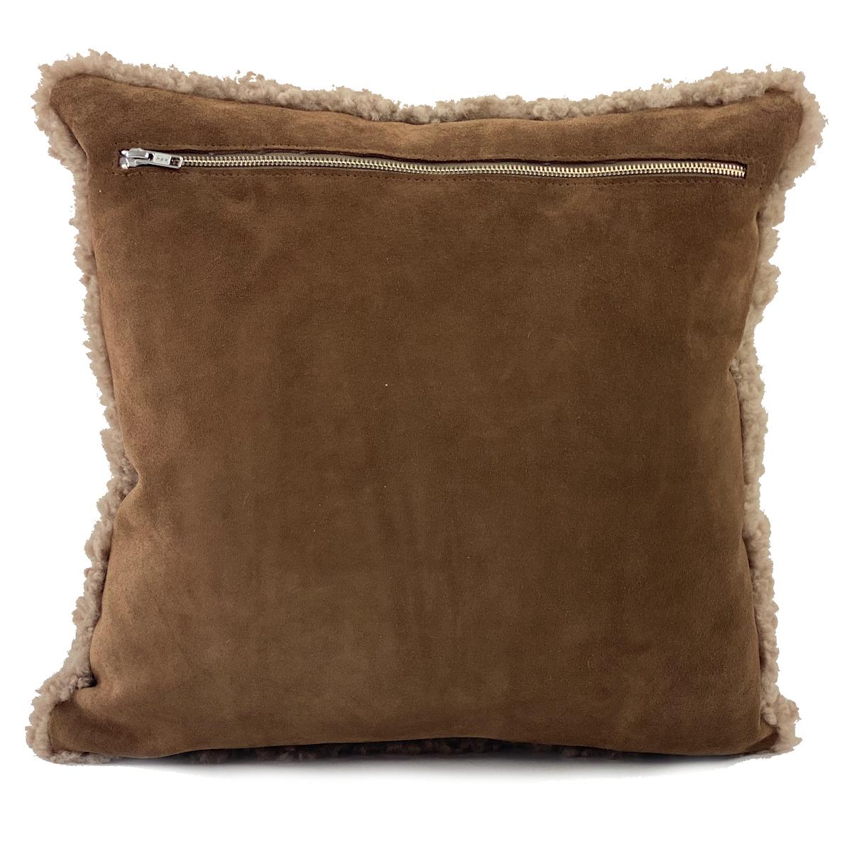 Elevate the cozy and natural textures in your decor with this hazelnut brown shearling pillow. The sheepskin wool features a short and curly wool pile that will add beautiful and alluring textures to a room. Part of the boucle collection, this