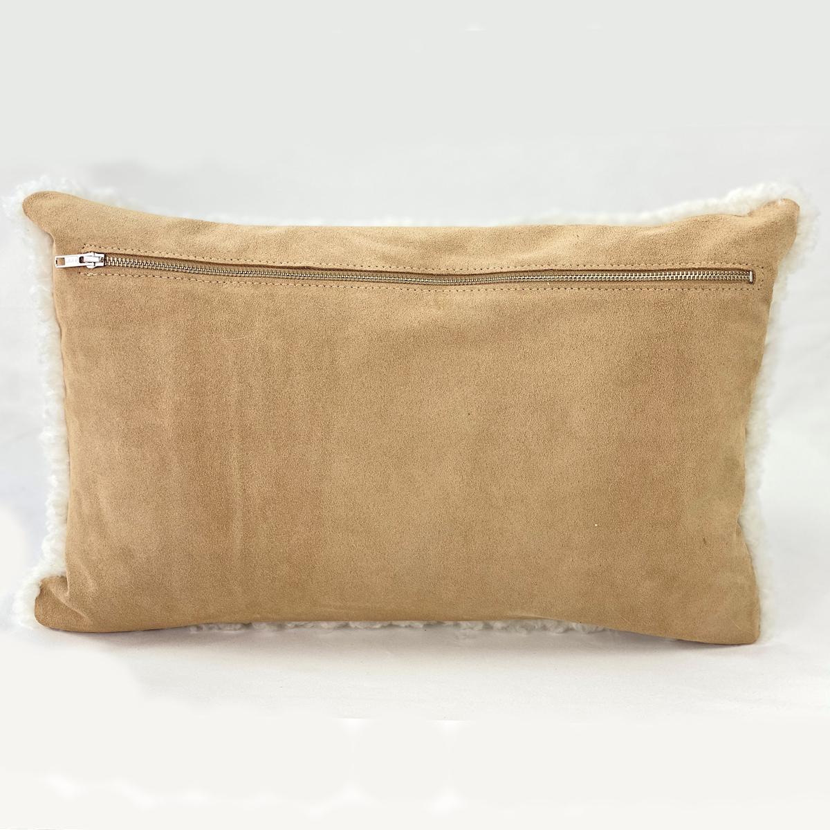 Transform a bed, sofa or arm chair with this endearing sheepskin shearling  pillow. The natural white sheepskin wool features a short and curly wool pile that will add will elevate charm and style to a room. Part of the boucle collection, this