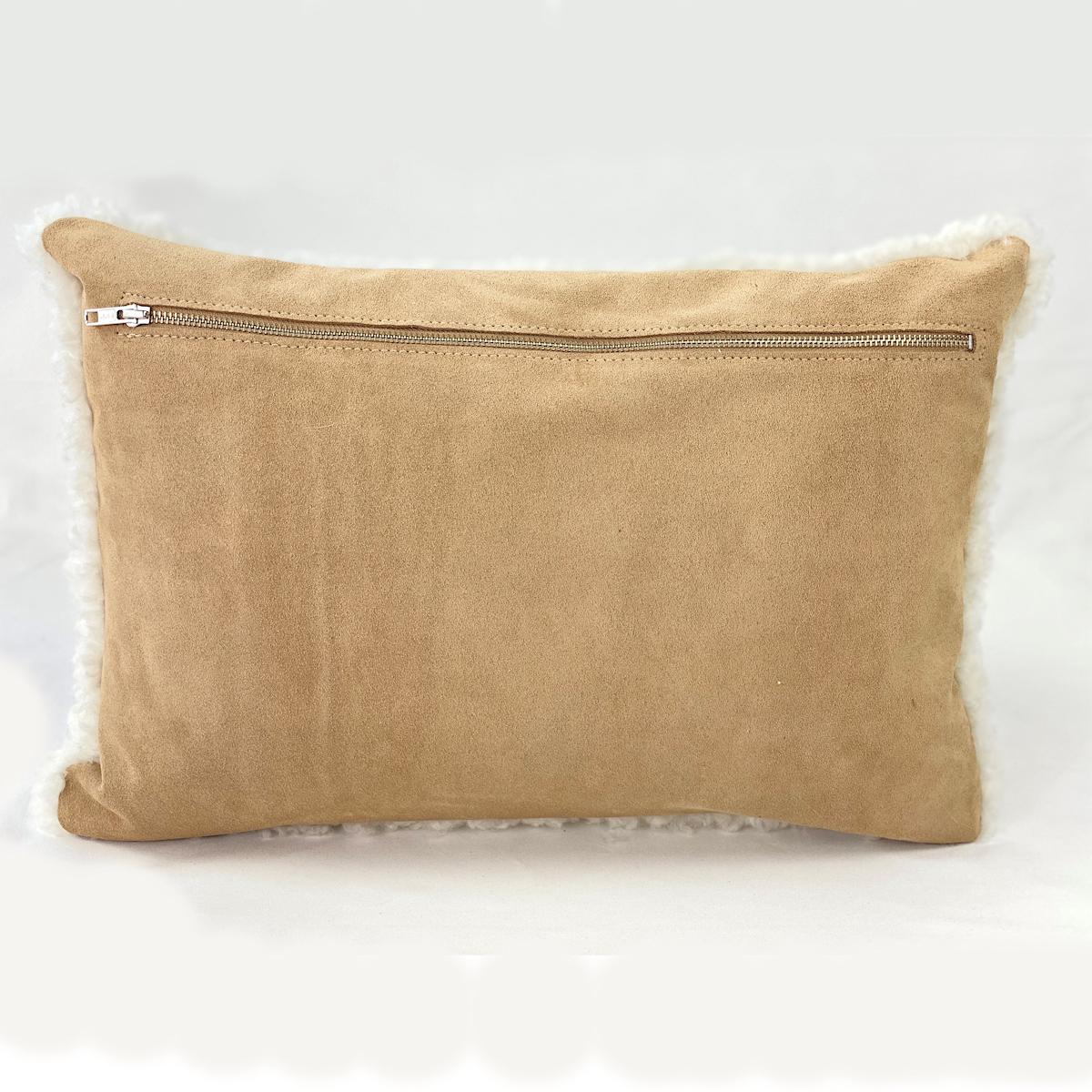 Transform your space with charm and inviting textures with this shearling sheepskin pillow. The white sheepskin wool features a short and curly wool pile that will add refreshing touches to a room. Part of the boucle collection, this shearling