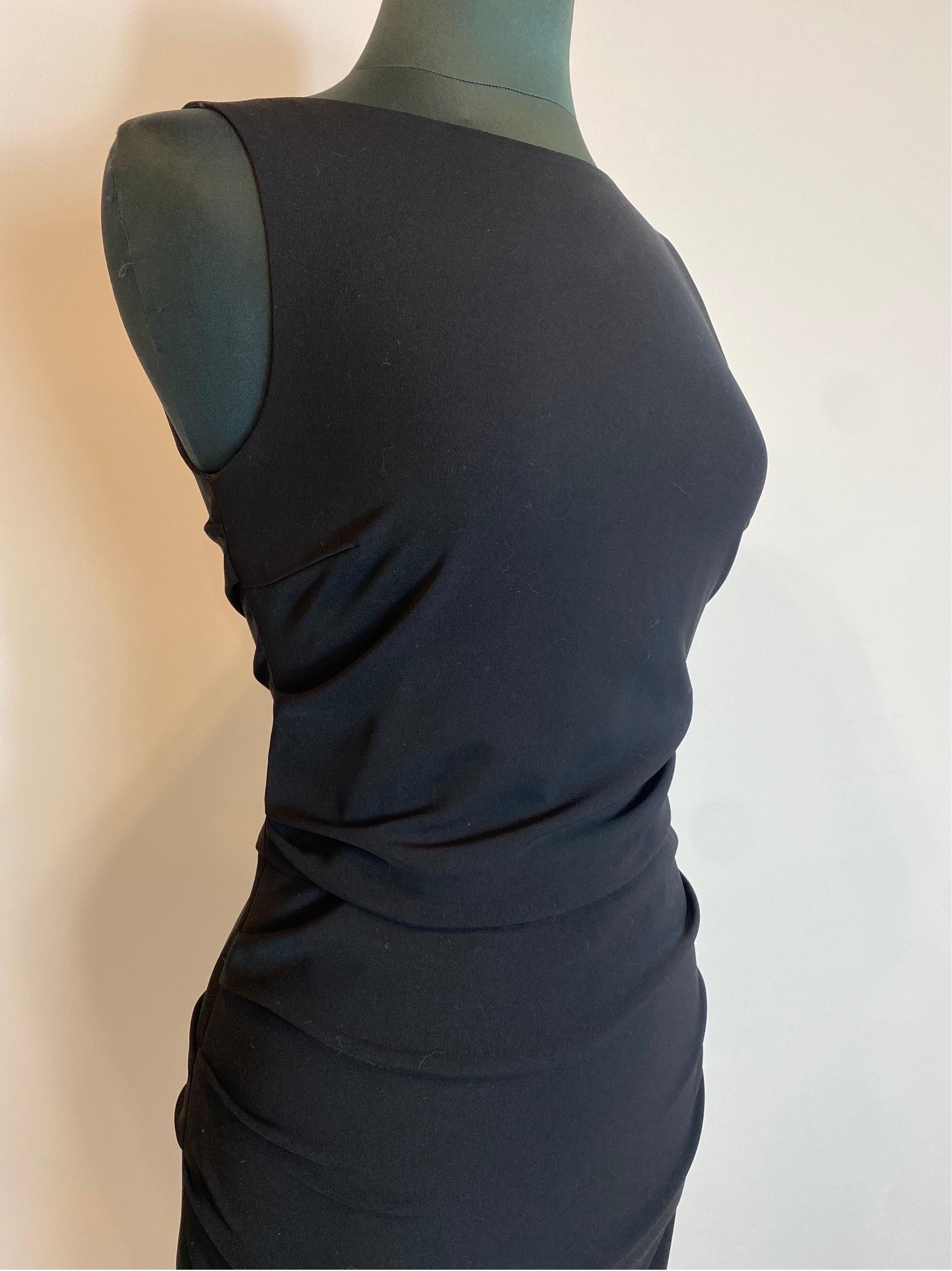 Black Dolce & Gabbana sheath dress
Made of polyester. Nice effect with curls on the sides.
Invisible zip closure on the back.
Size 42.
Shoulders 33
Length 102
Breast 42
Bust 43
Hips 47
In very good condition, shows signs of normal use.