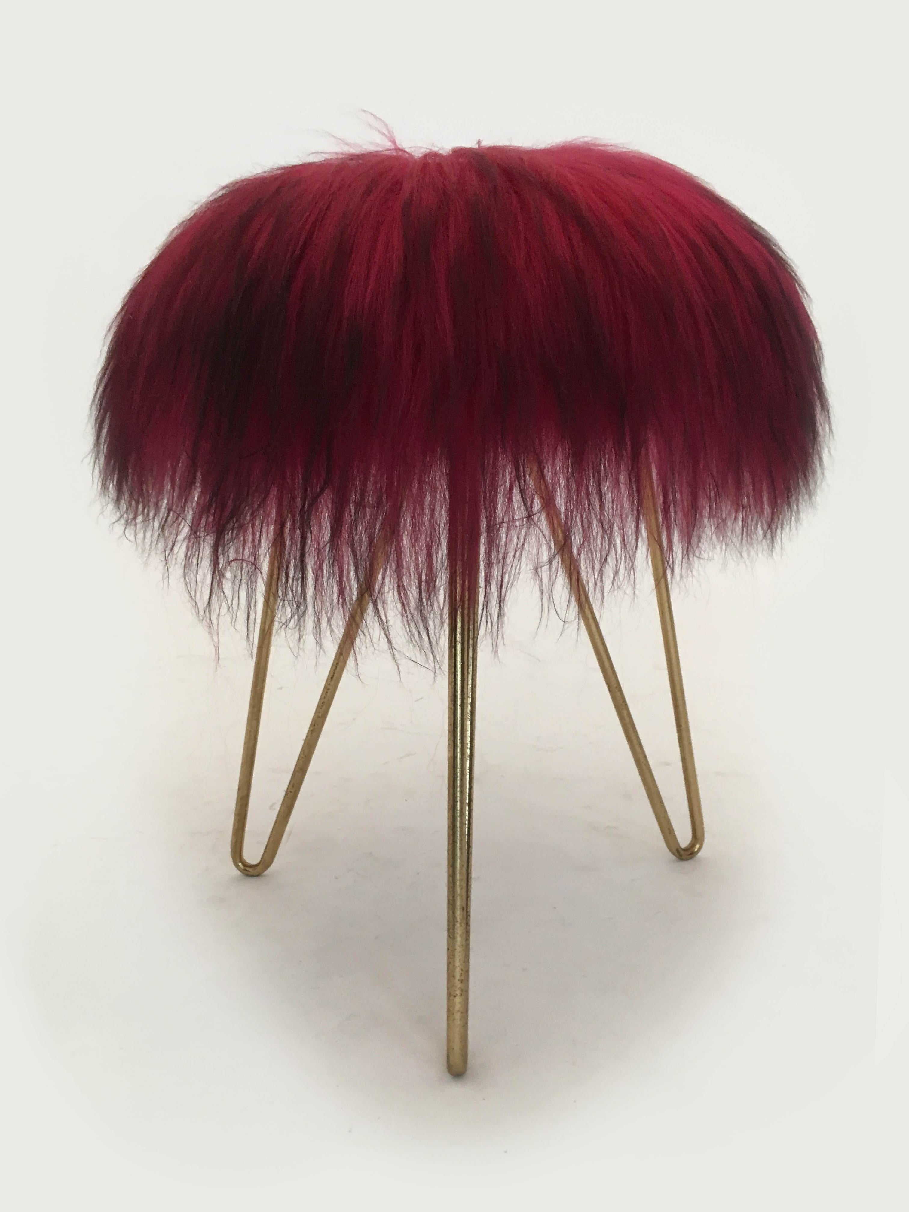 Delightful pair of sheep fur stools, France, 1950s. In excellent vintage condition with just the right amount of gently aged patina on the hair pin brass legs. The fur is clean and firm almost like new, although truly vintage from the 1950s and has