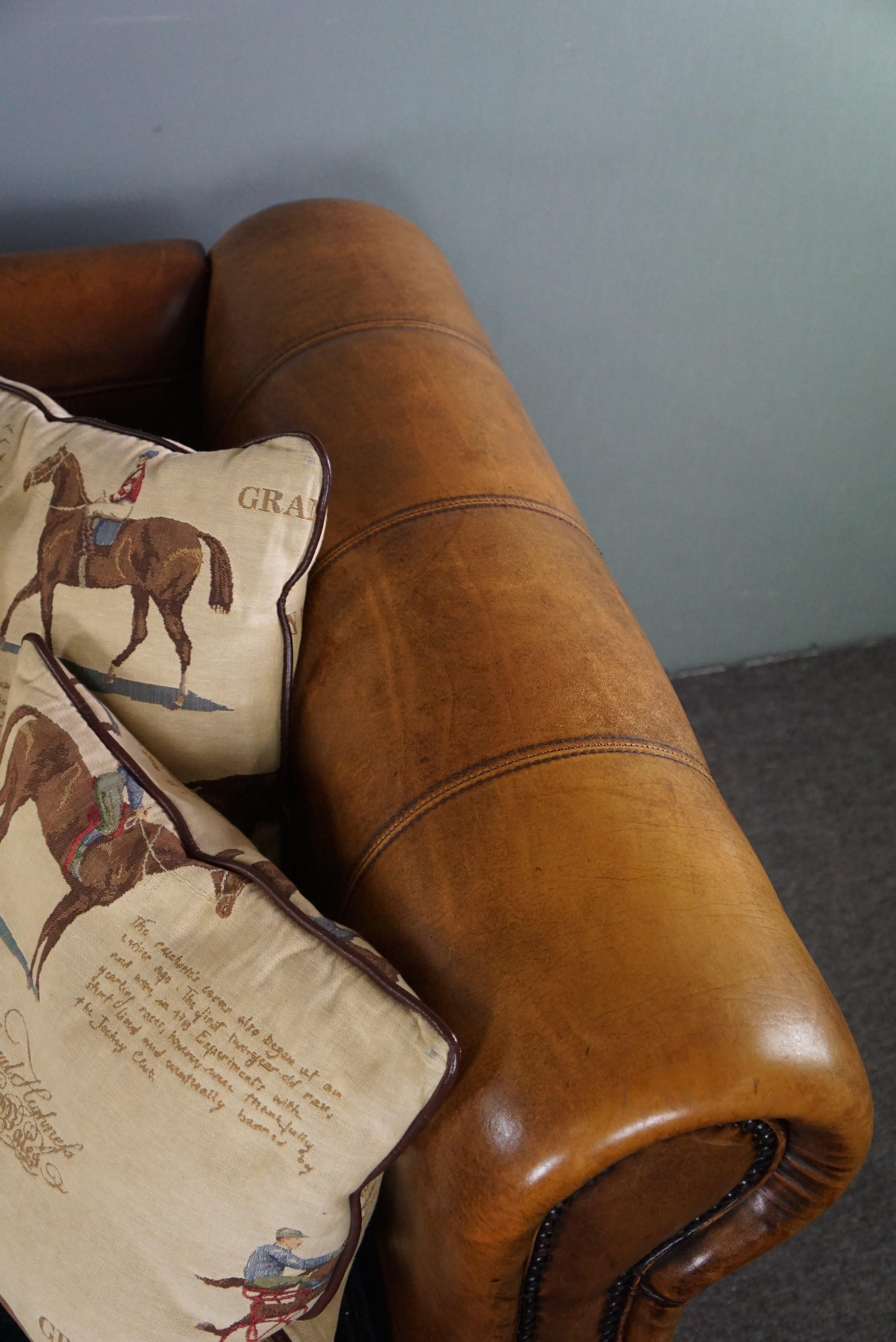 Leather Sheep leather 3-seater sofa with fabric cushions featuring a horse motif For Sale