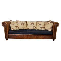 Vintage Sheep leather 3-seater sofa with fabric cushions featuring a horse motif
