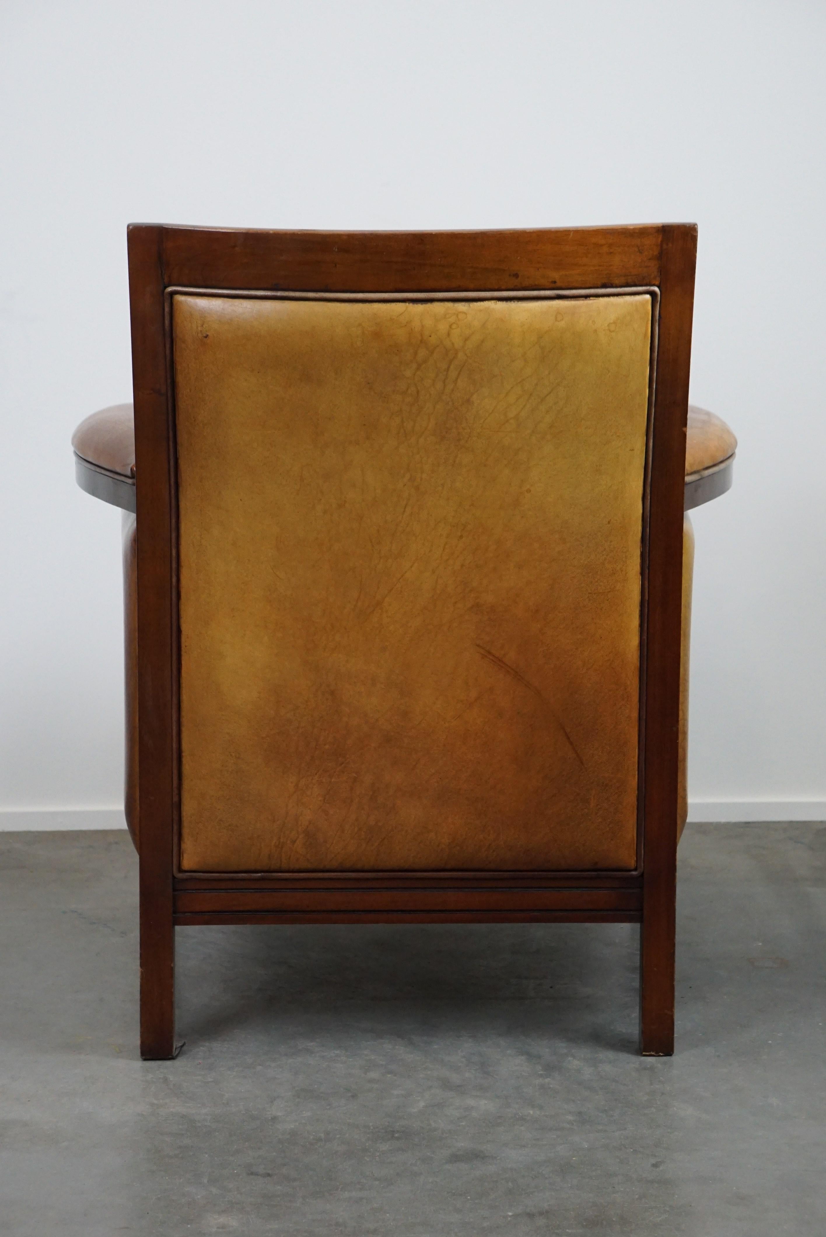 20th Century Sheep leather Art Deco design armchair with high seating comfort For Sale