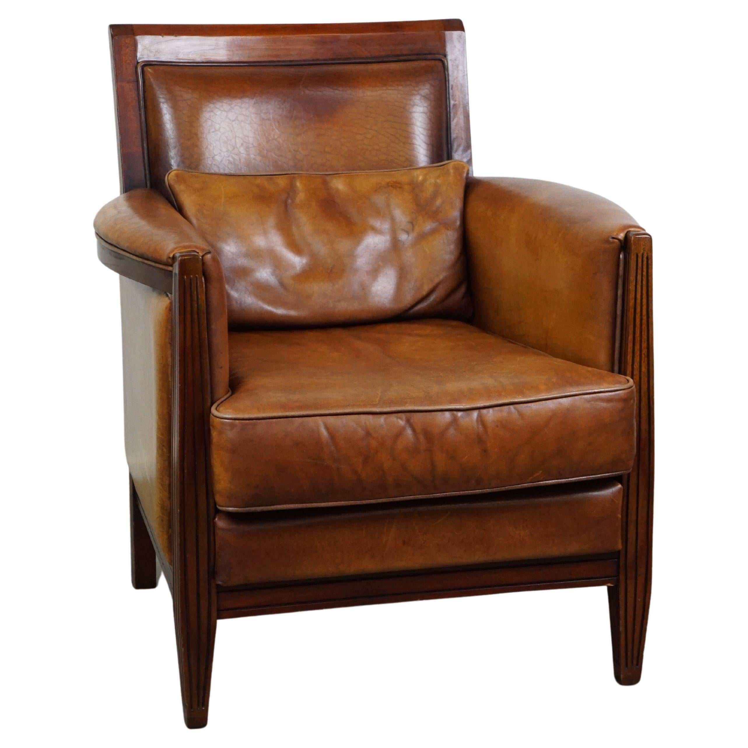 Sheep leather Art Deco design armchair with high seating comfort For Sale