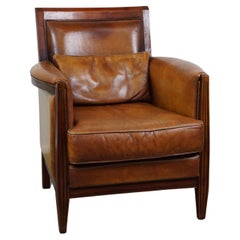 Vintage Sheep leather Art Deco design armchair with high seating comfort