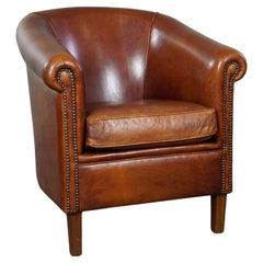 Retro Sheep leather club armchair with a beautiful cognac color