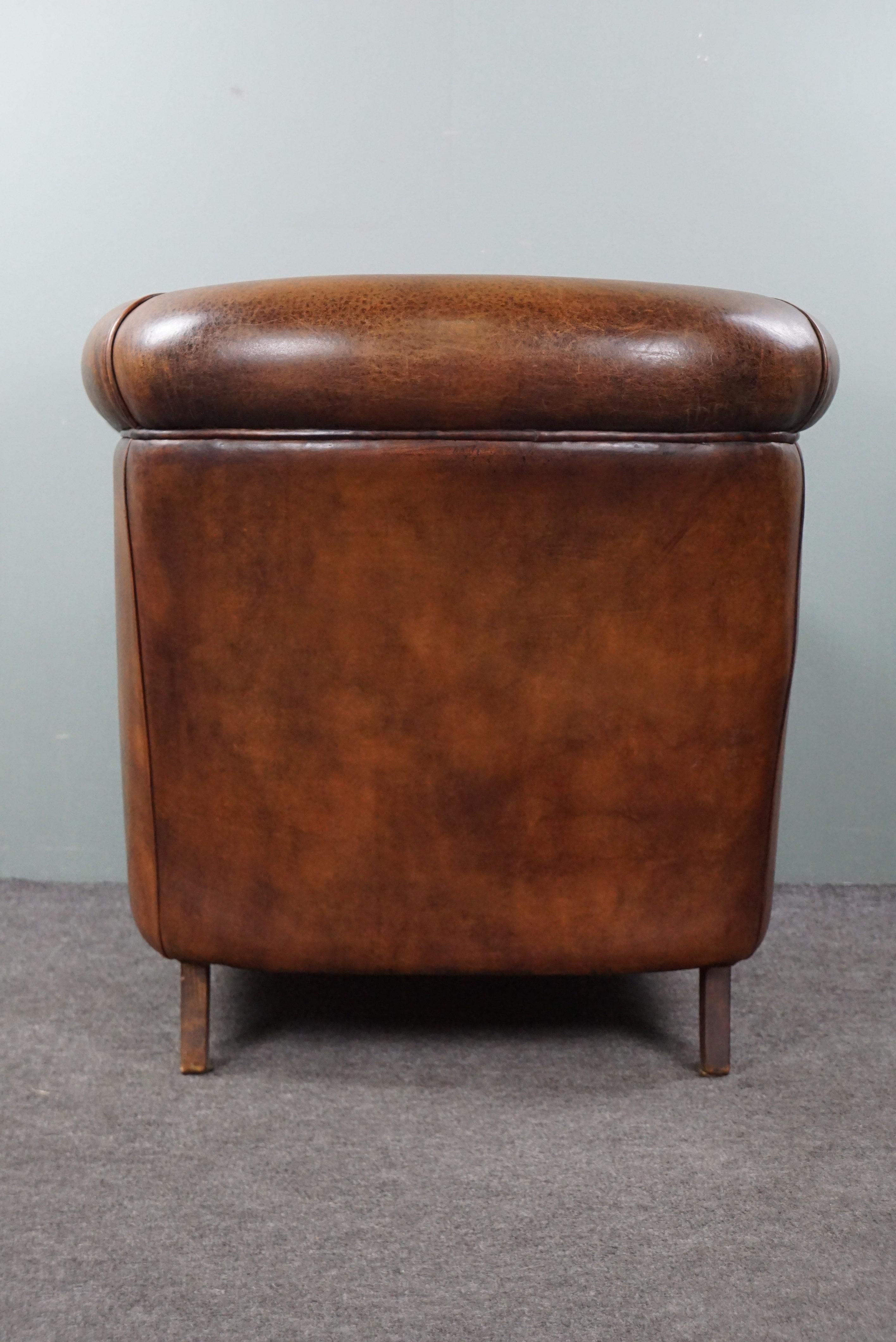 Mid-20th Century Sheep leather club armchair with a beautiful patina and a tone-on-tone piping For Sale