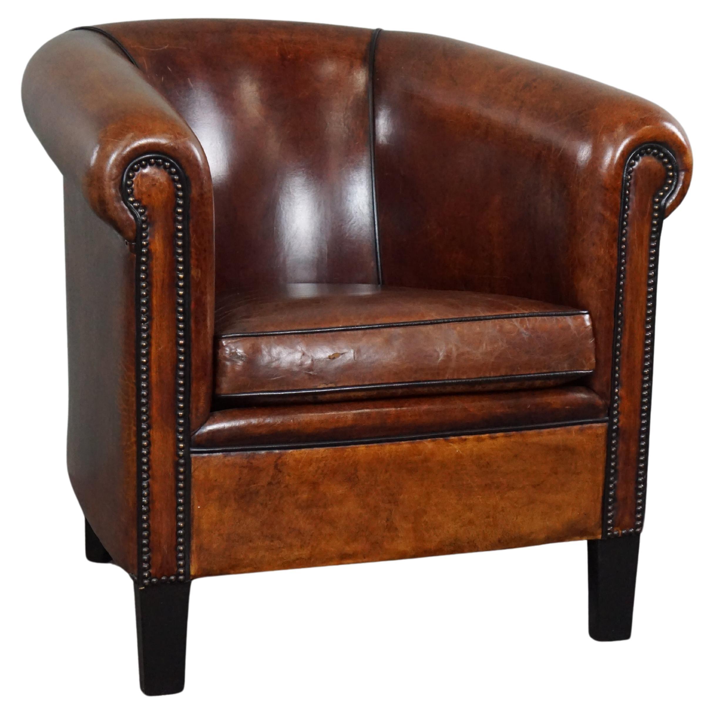 Sheep leather club chair with black piping and decorative nails For Sale