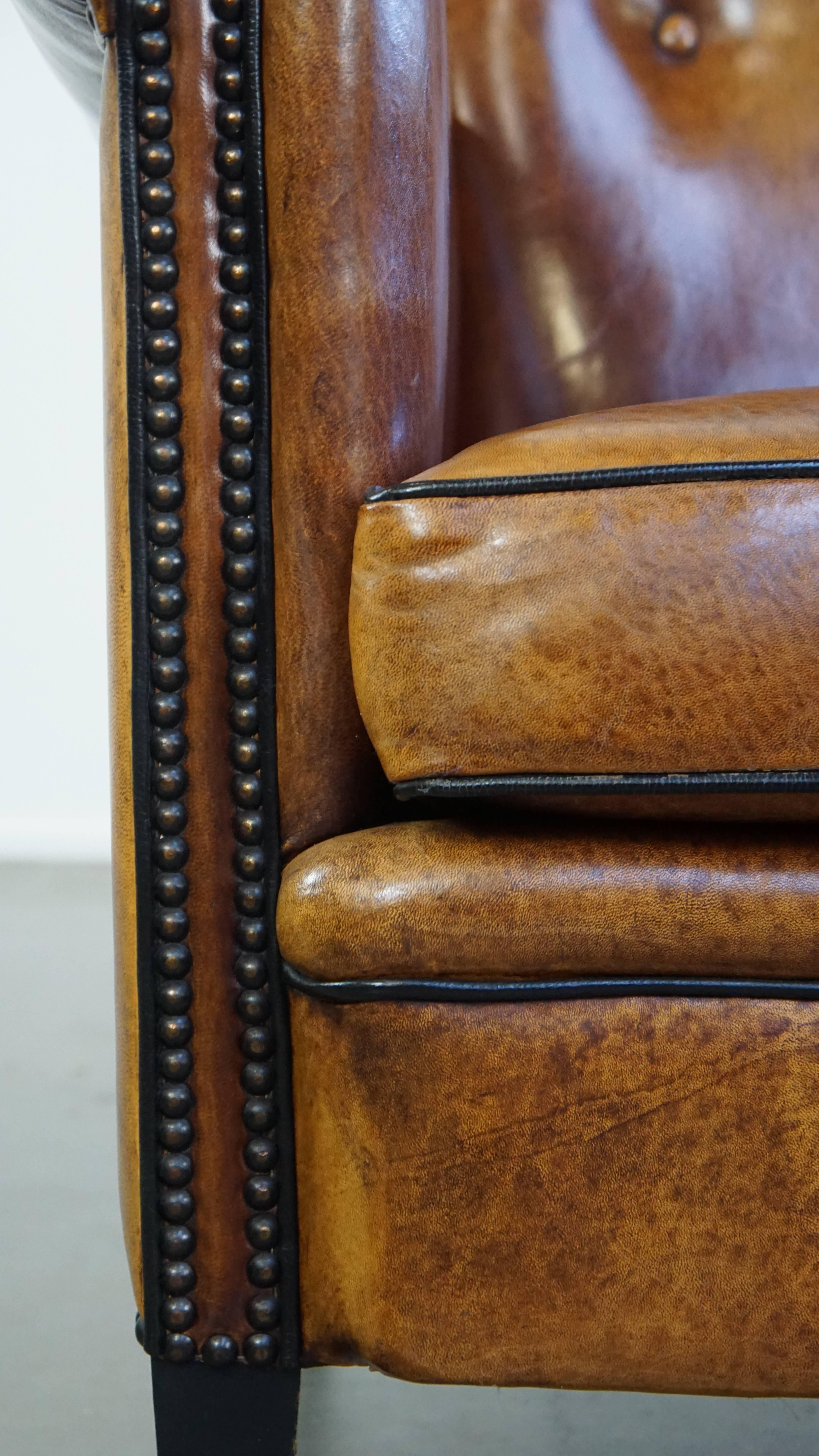 Sheep leather design armchair finished with decorative nails and black piping For Sale 4