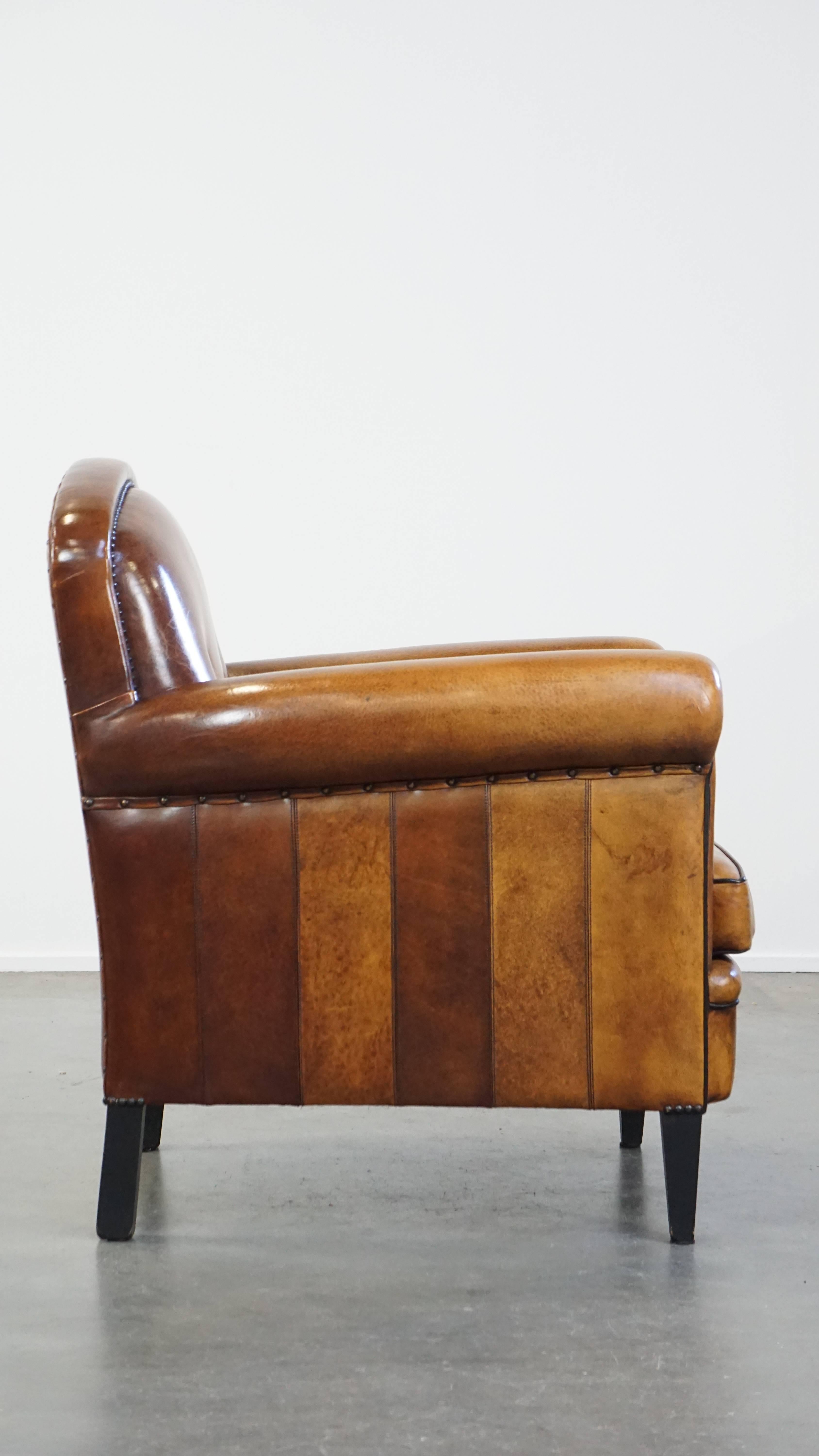 Hand-Crafted Sheep leather design armchair finished with decorative nails and black piping For Sale